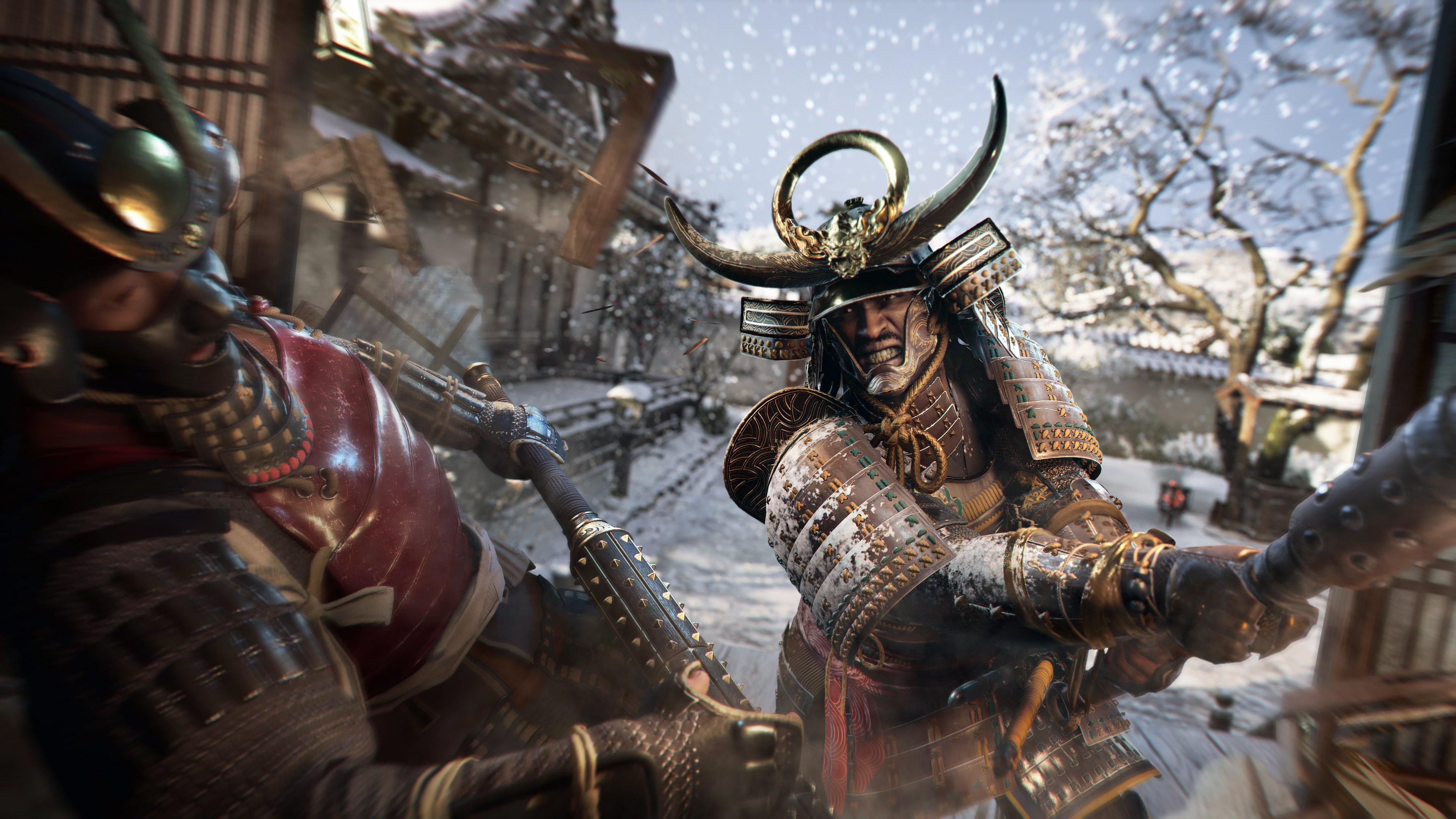 Due guerrieri samurai in armatura si scontrano in un ambiente innevato. Uno ha un elmo cornuto, l'altro una piastra rossa.