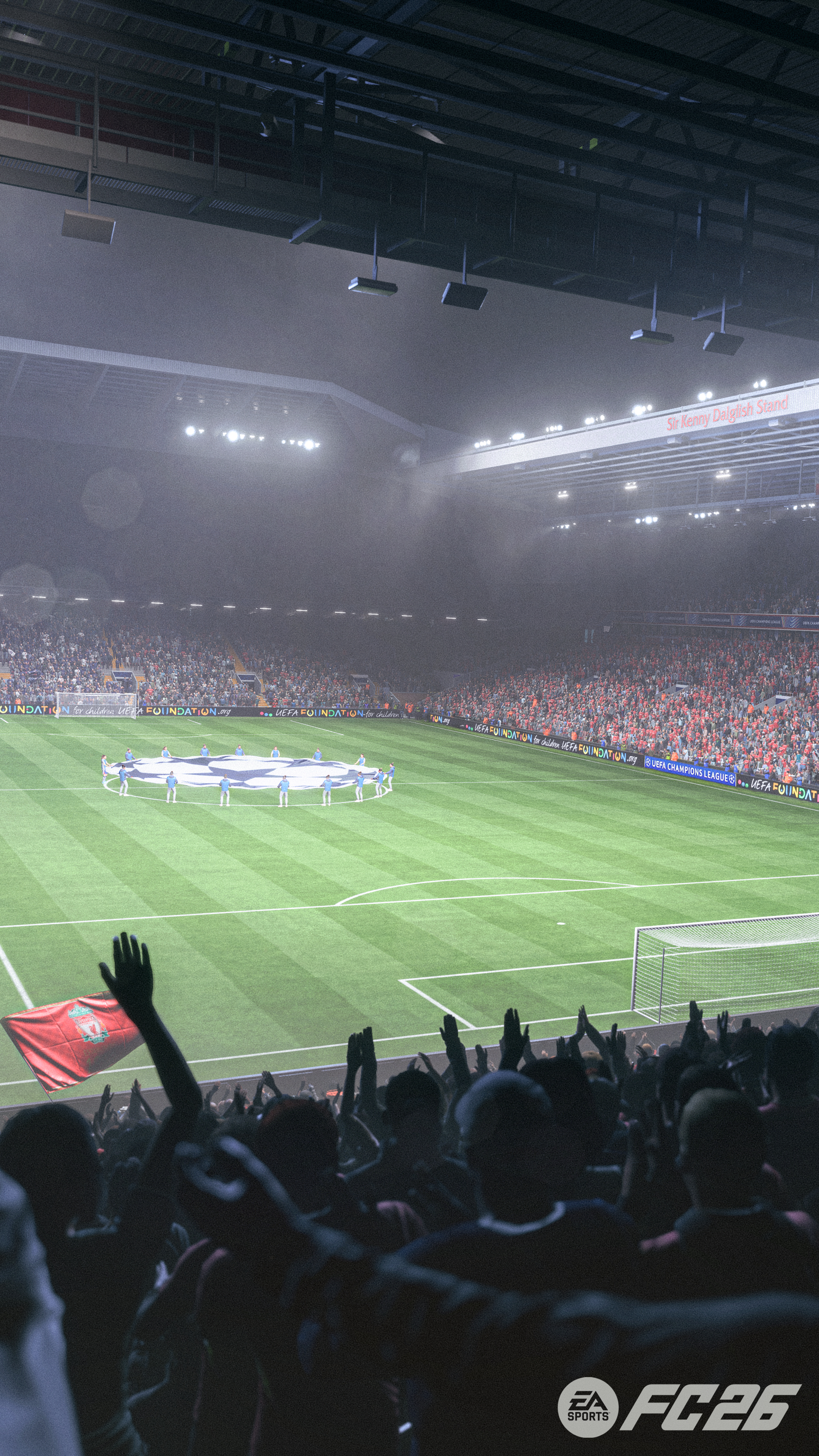 Stadion z tłumem, boiskiem i flagą. Ludzie wiwatują. Logo Ligi Mistrzów UEFA w tle.