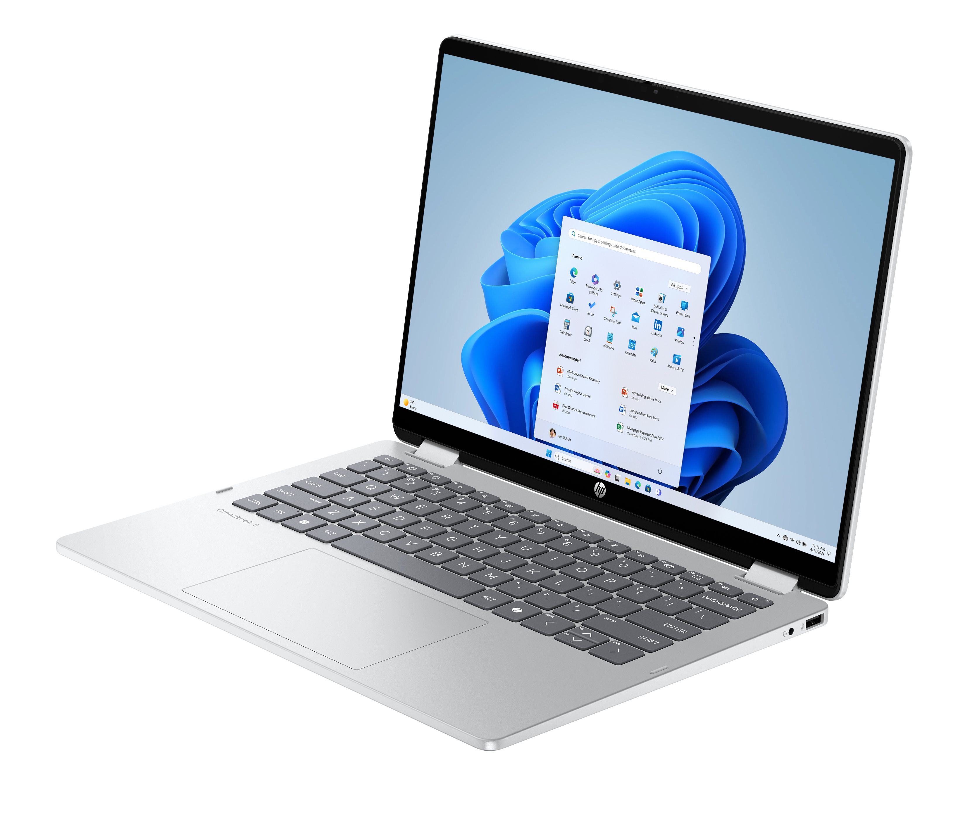 Laptop argento aperto, mostra interfaccia Windows. Tastiera visibile, con sfondo blu sullo schermo.