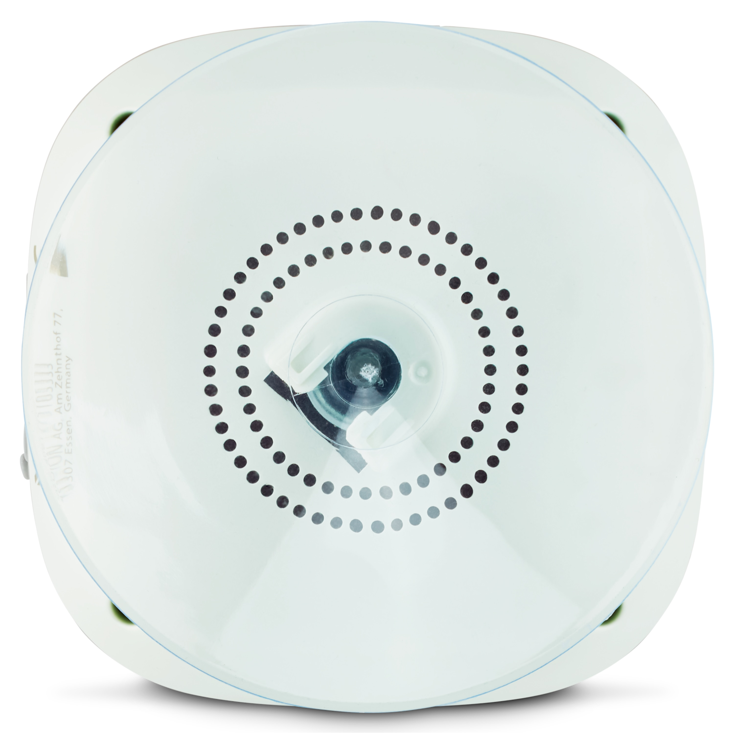 A white, circular device with a central lens and surrounding black dots, set against a white background.