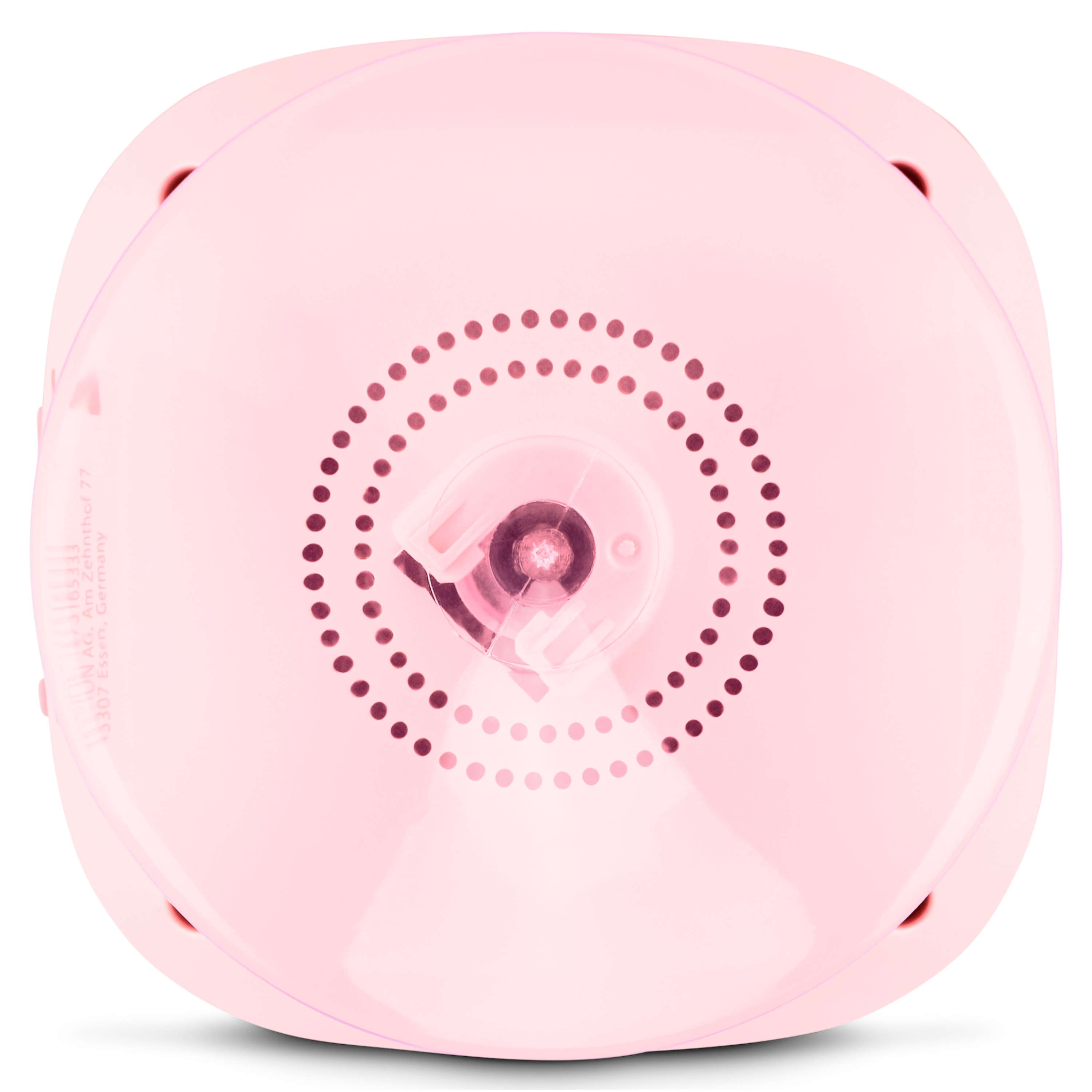 Pink, rounded object with a dotted circle in the center. Small holes are visible around the edge, and the bottom is flat.