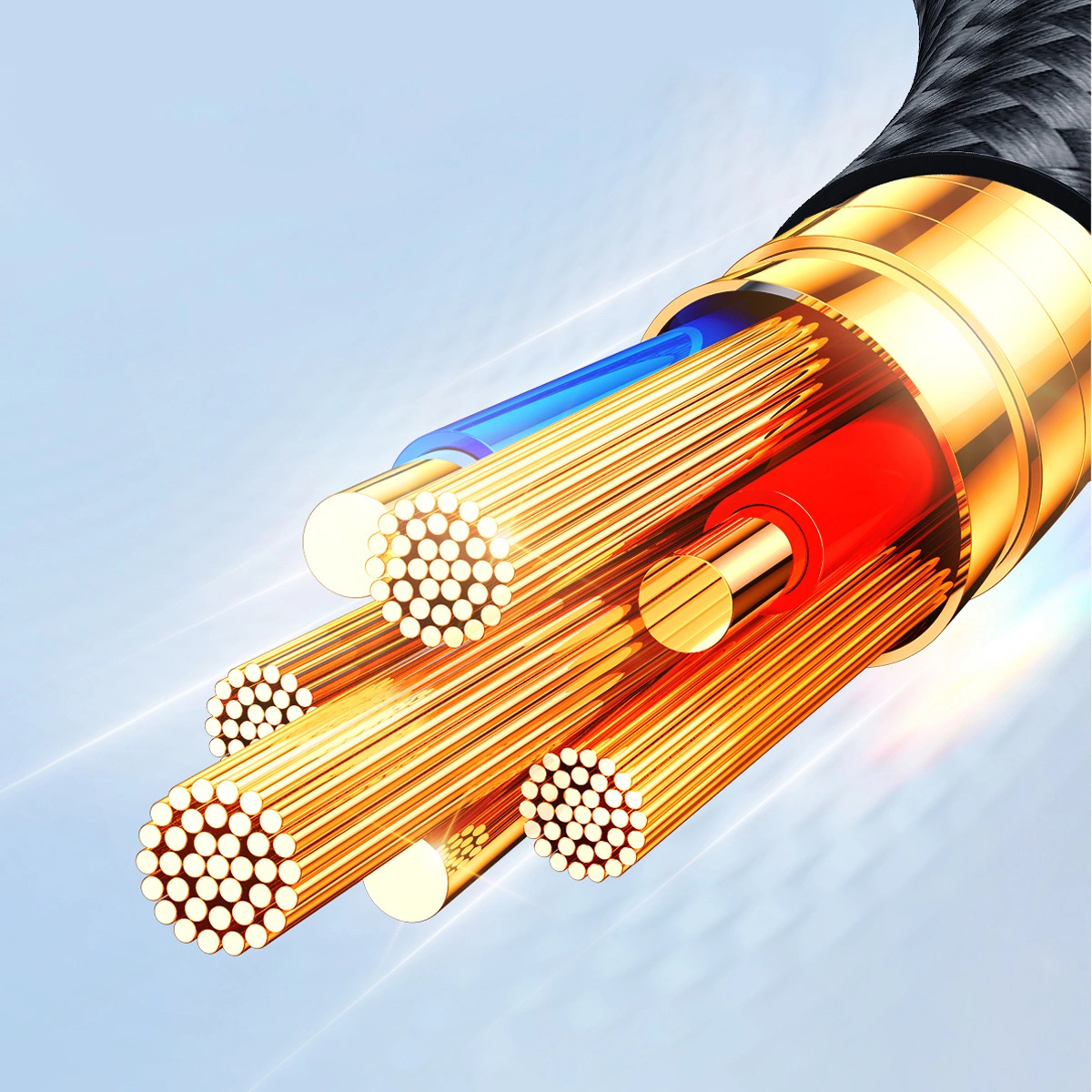 Zbliżenie przeciętego kabla, odsłaniające wewnętrzne przewody. Widoczne są złote, czerwone i niebieskie przewody, z czarną, plecioną warstwą zewnętrzną.