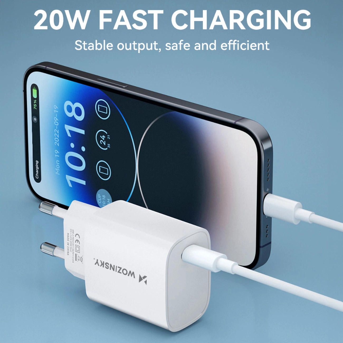 Telefon ładujący się białą ładowarką. Ekran pokazuje godzinę i procent naładowania baterii. Tekst u góry mówi 20W Fast Charging.
