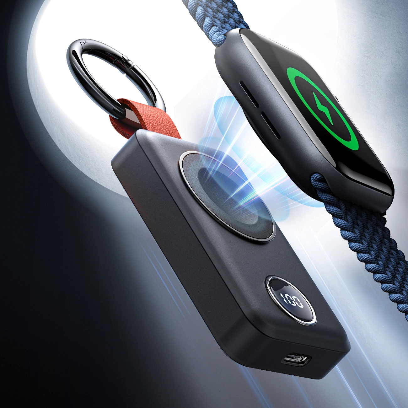 Schwarzes kabelloses Ladegerät mit Anzeige 100%. Ladeanzeige vorhanden. Ein blau geflochtenes Kabel ist sichtbar.