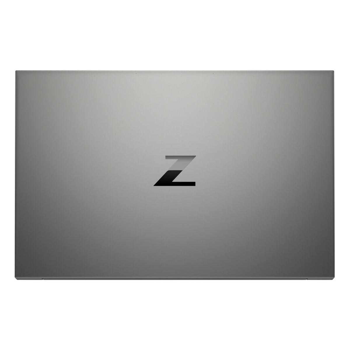 Szara pokrywa laptopa z czarnym logo 'Z' na środku. Powierzchnia jest gładka i odbija światło, sugerując metaliczne wykończenie.