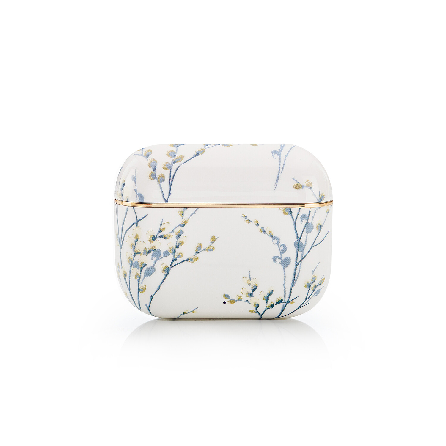 Eine weiße, abgerundete Box mit einem Blumendesign in Blau und Gelb. Ein Goldband umgibt die Mitte. Der Hintergrund ist weiß.