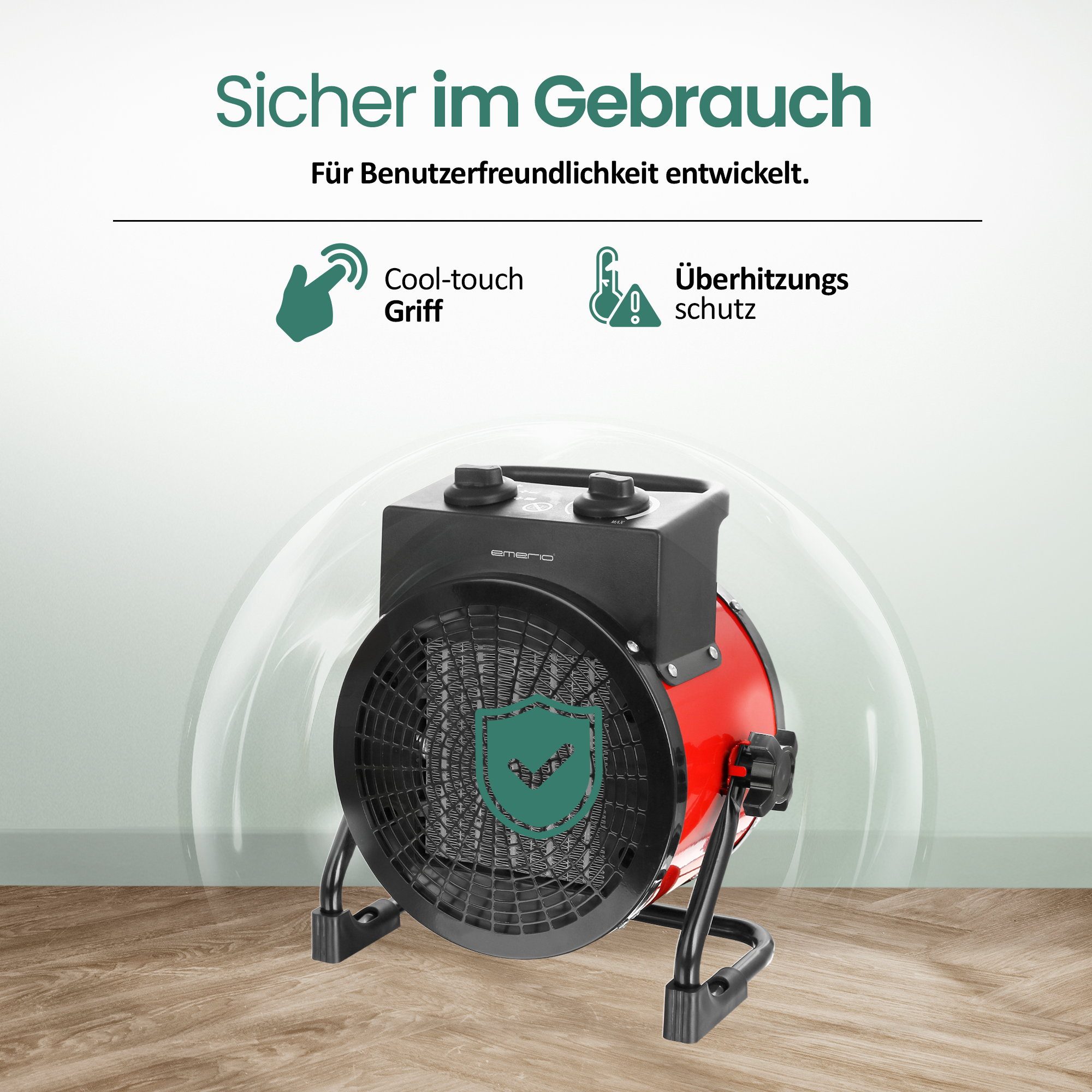 Ein roter und schwarzer Elektroheizer mit Sicherheitsmerkmalen auf Holzoberfläche.