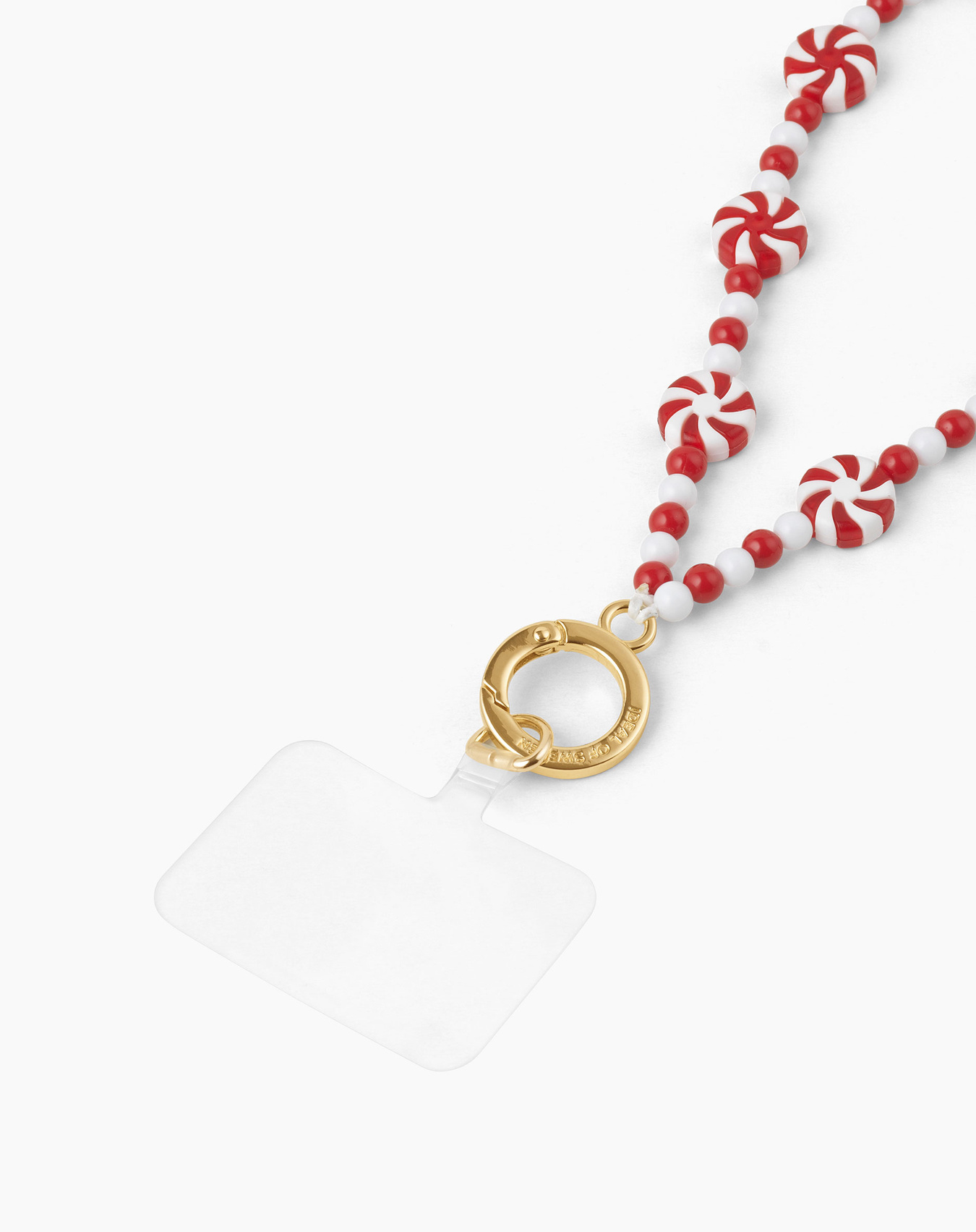 Weißer Hintergrund mit einem Schlüsselband. Das Schlüsselband hat rot-weiße Zuckerstangenperlen und einen goldenen Verschluss mit einem durchsichtigen Quadrat.