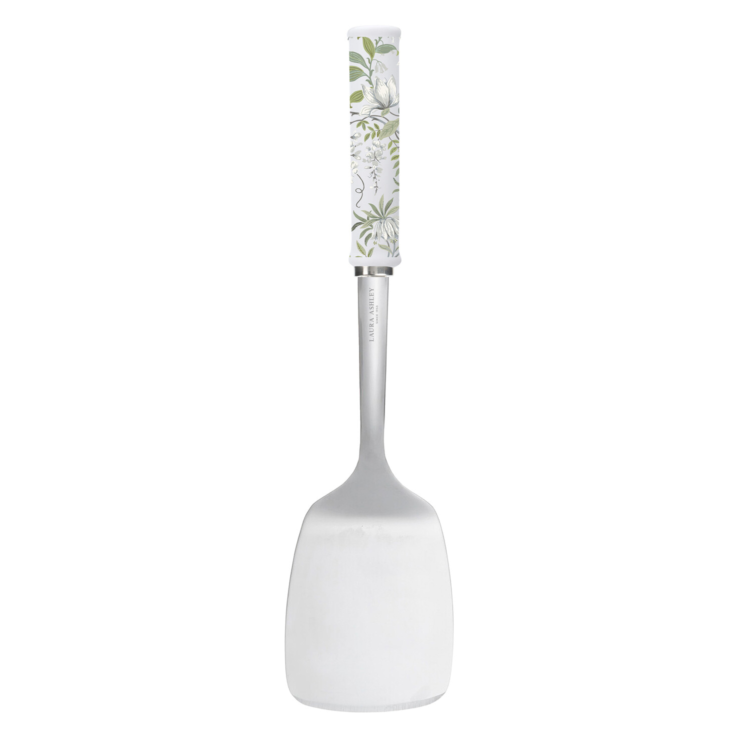 Ein Pfannenwender mit floral gemustertem Griff, der Pfannenwender ist weiß, mit einem silbernen Metallteil und weißer Klinge, auf weißem Hintergrund.