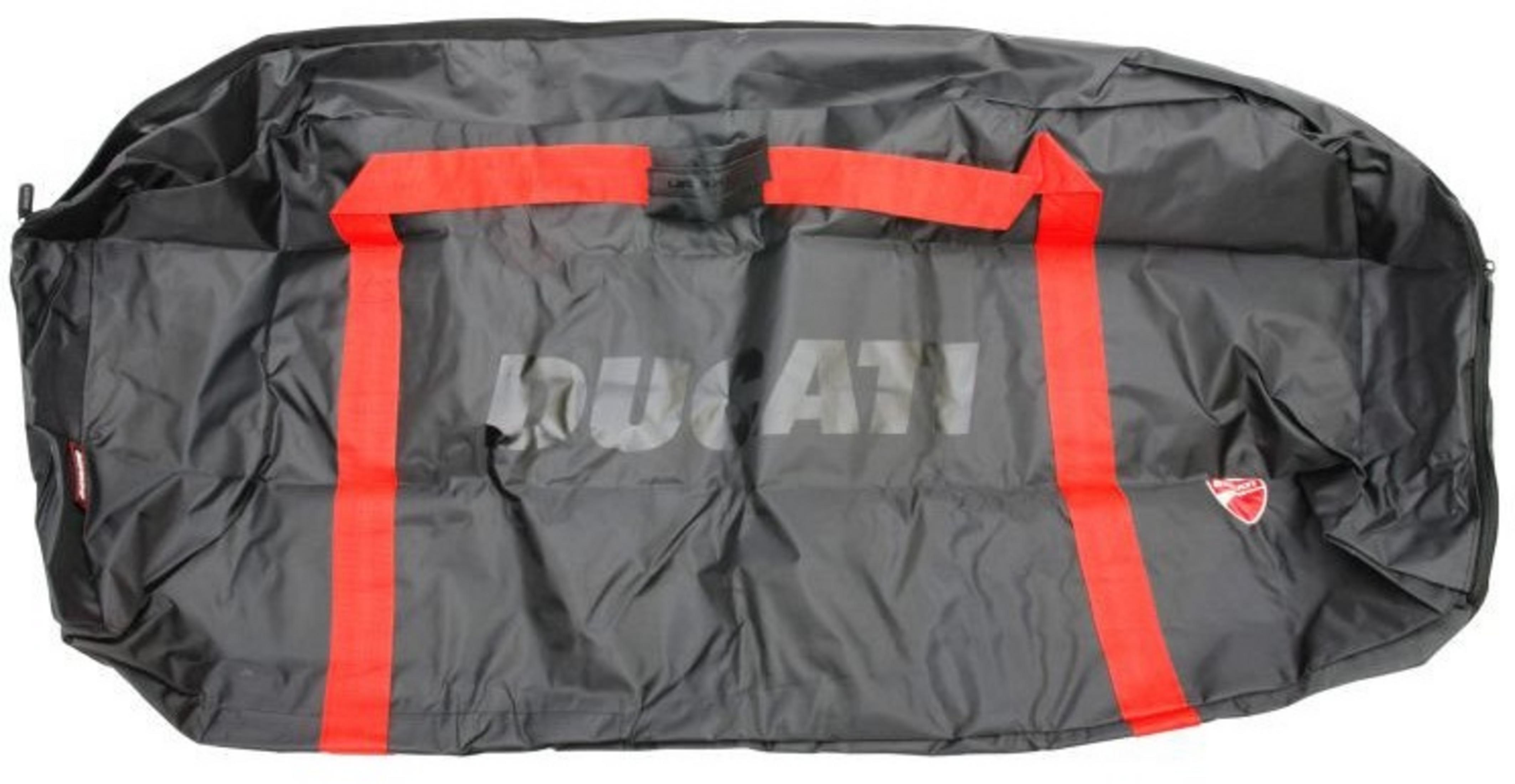 Black Ducati motorcycle cover with red stripes and logo. The cover is folded. The Ducati logo is visible.
