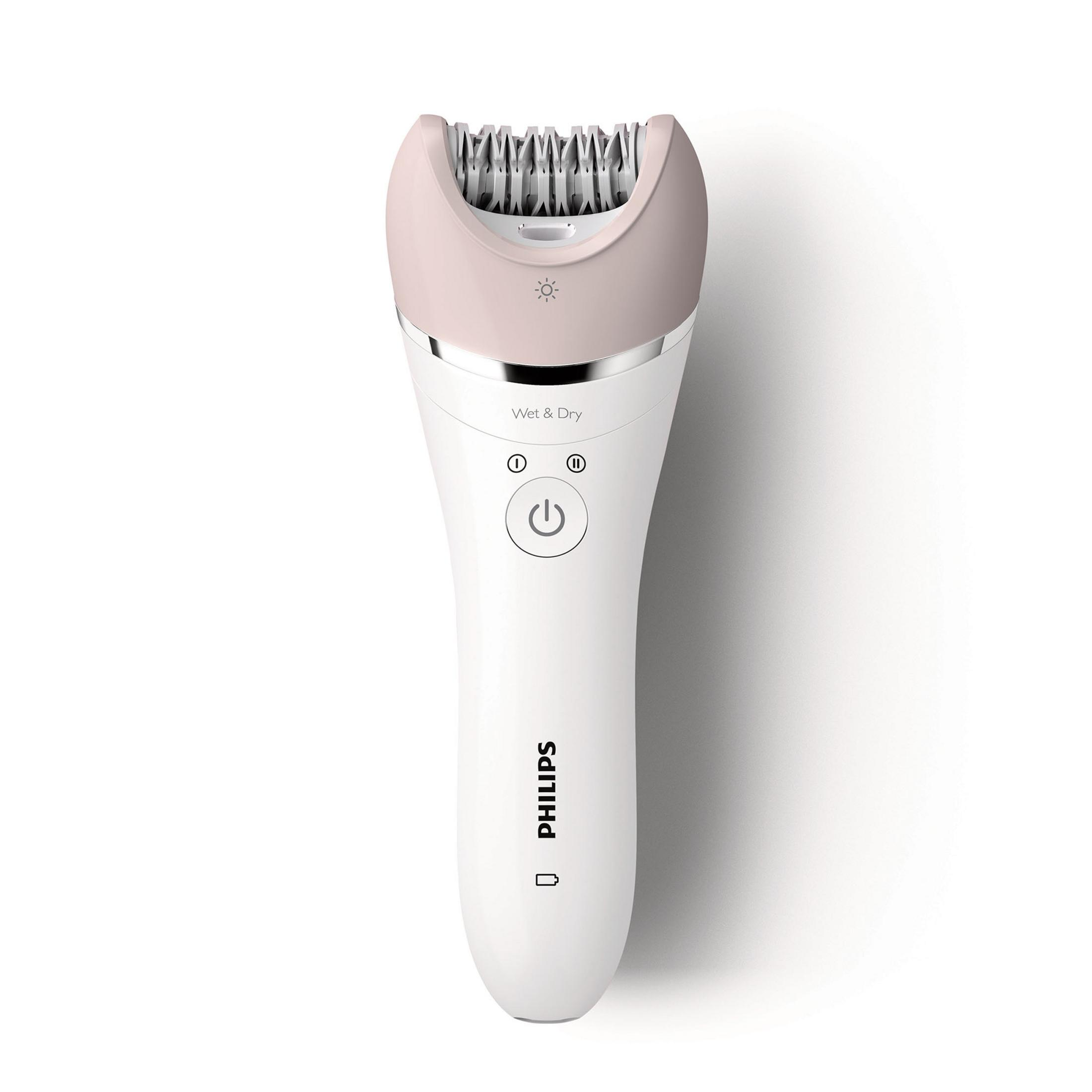 Una depiladora Philips blanca y rosa. Tiene un cabezal redondeado con cuchillas, un botón de encendido y el logotipo de Philips.