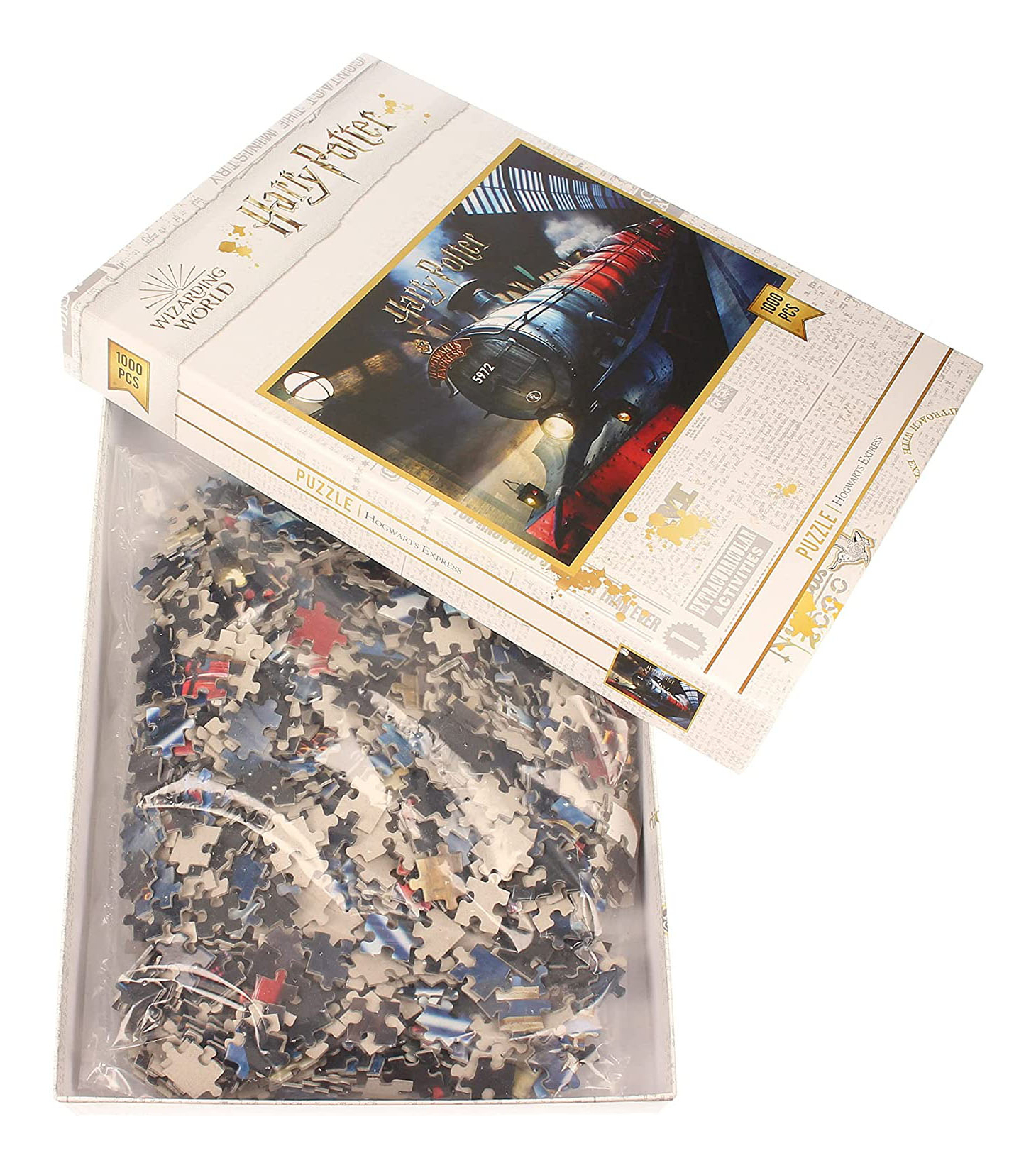 Eine Harry-Potter-Puzzledose ist geöffnet und zeigt Teile in einer Plastiktüte. Die Schachtel zeigt ein Zugbild. Auf der Schachtel steht 'Hogwarts Express'.
