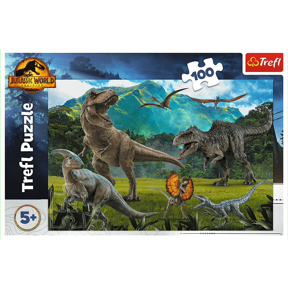 Puzzle Jurassic World z różnymi dinozaurami. Zawiera T-Rexa, raptory i inne gatunki na tle gór.