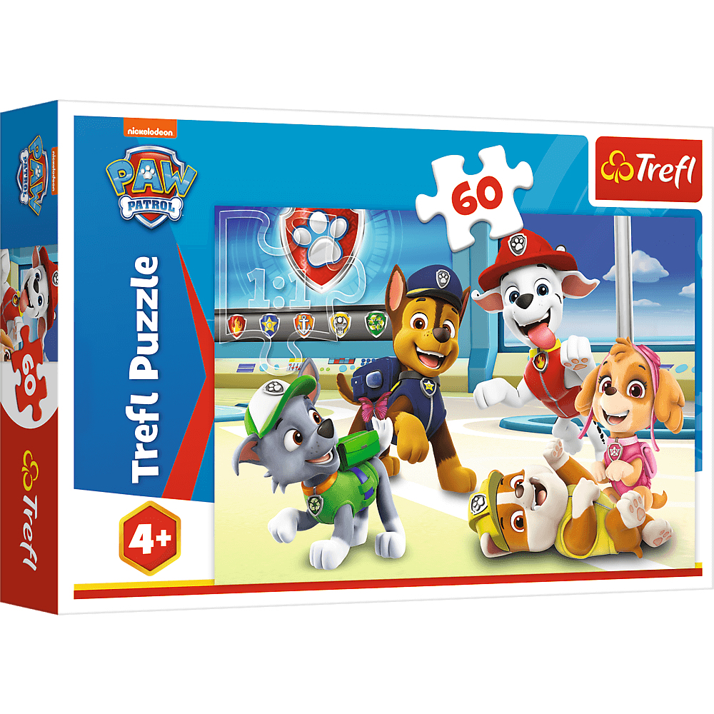 Pudełko z puzzlami Paw Patrol Trefl. Zawiera postacie z Paw Patrol: Chase, Marshall, Skye, Rocky i Rubble. Pudełko jest niebieskie i czerwone.