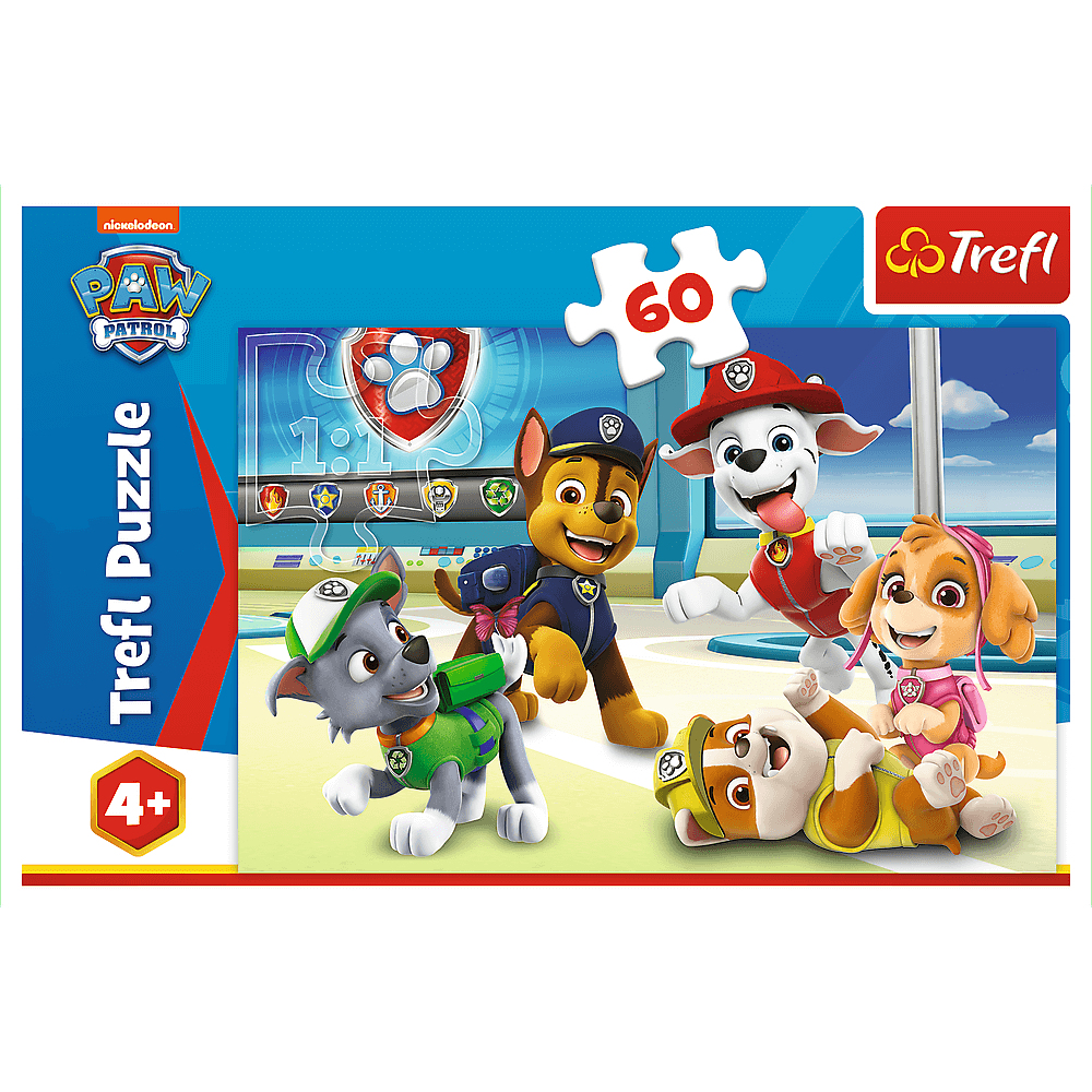 Puzzle z Psiego Patrolu z sześcioma psami z kreskówek. Obecni są Chase, Marshall, Skye, Rocky i Zuma. Puzzle mają niebiesko-białe tło.