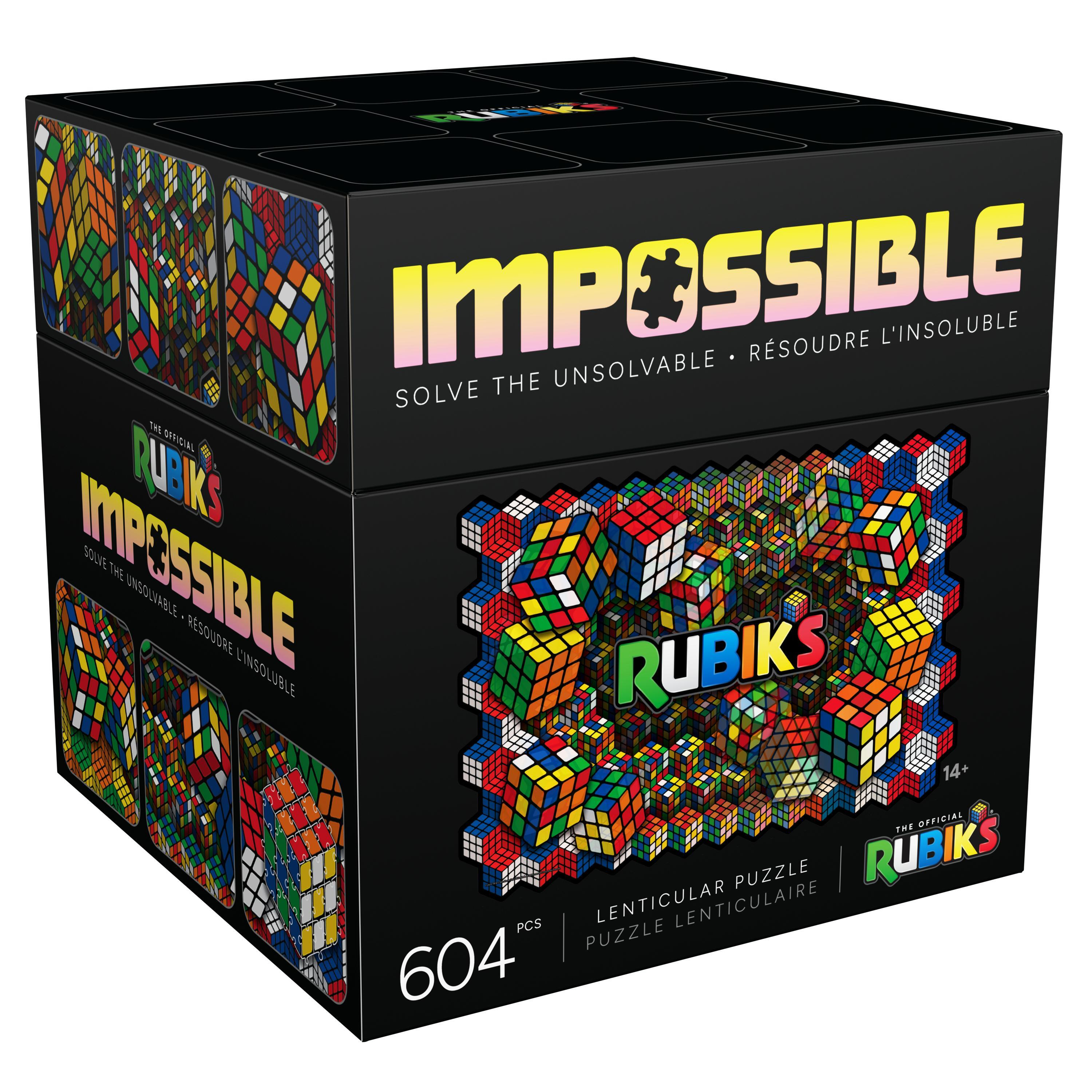 Schachtel mit Rubik's Impossible Puzzle. Es hat Rubik's und Impossible drauf geschrieben. Einige Rubik's Würfel sind sichtbar.