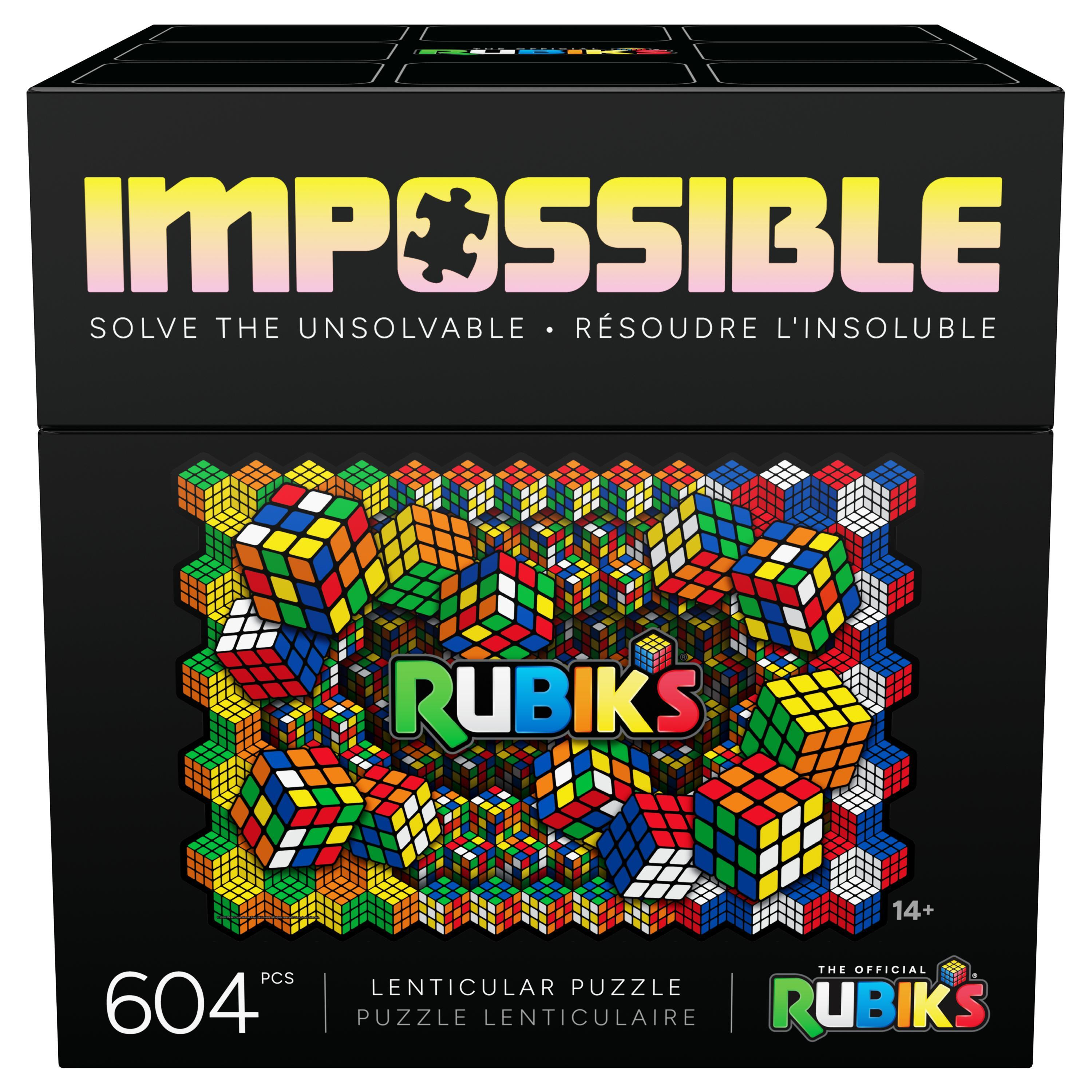 Schachtel mit Rubik's Impossible Puzzle. Im Hintergrund Rubik's Würfel. Text: Impossible, Löse das Unlösbare.