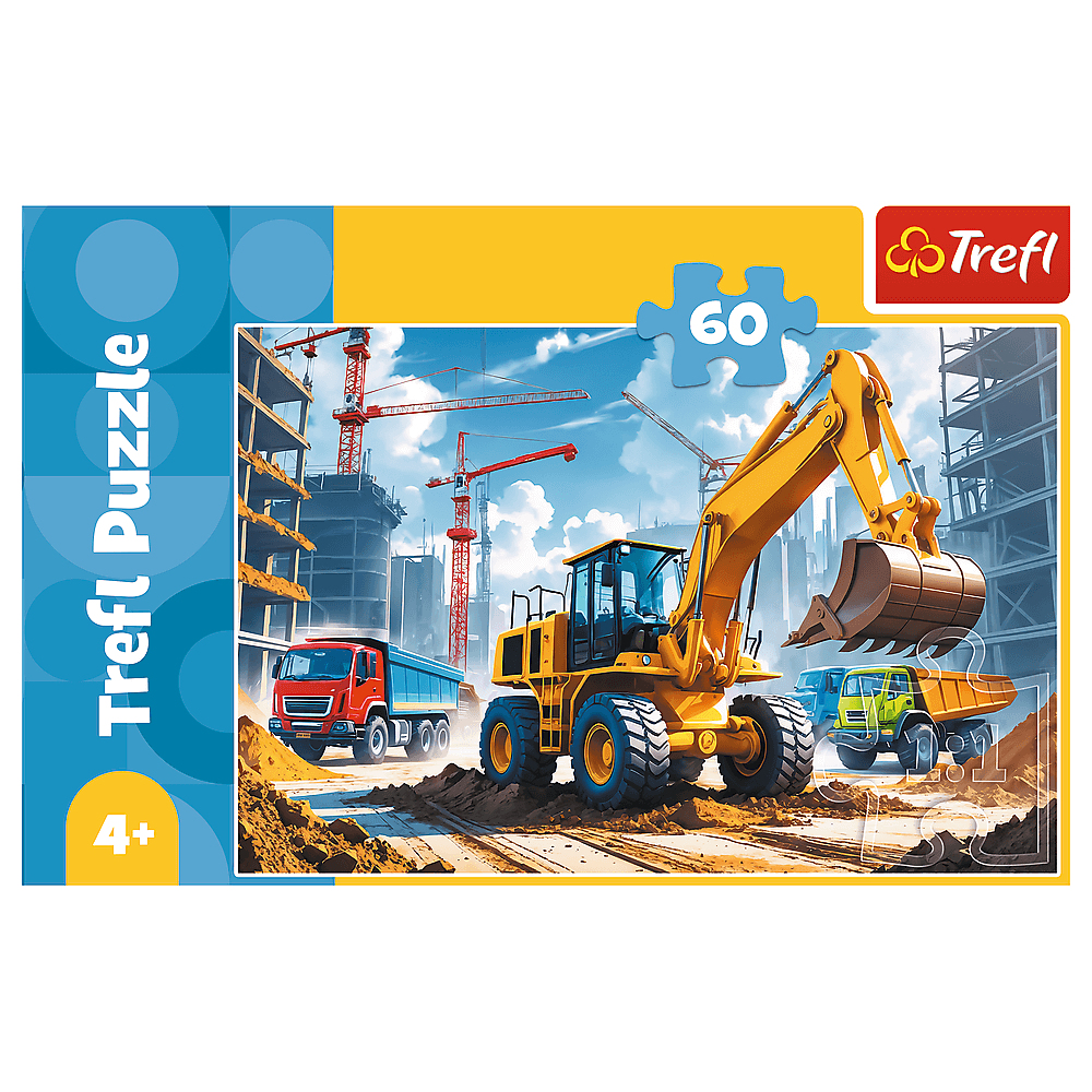 Puzzel toont een bouwplaats met gele graafmachine, rode vrachtwagen en andere voertuigen. Kranen en gebouwen op de achtergrond.