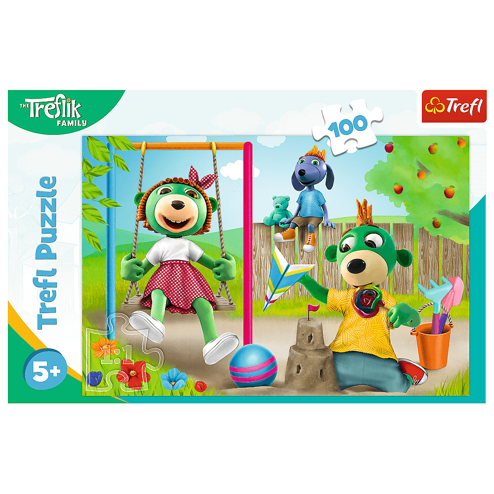 Eine Trefl-Puzzleschachtel. Zeichentrickhunde spielen auf einem Spielplatz. Einer auf einer Schaukel, ein anderer baut eine Sandburg.