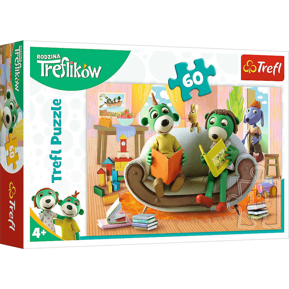 Een Trefl-puzzeldoos met stripfiguren die boeken lezen op een bank. Speelgoed en een puzzel van 60 stukjes zijn ook zichtbaar.