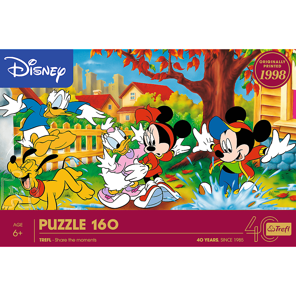 Eine Disney-Puzzleschachtel mit Micky, Minnie, Donald, Daisy und Pluto. Herbstszene mit Haus, Baum und Wasserpfütze.