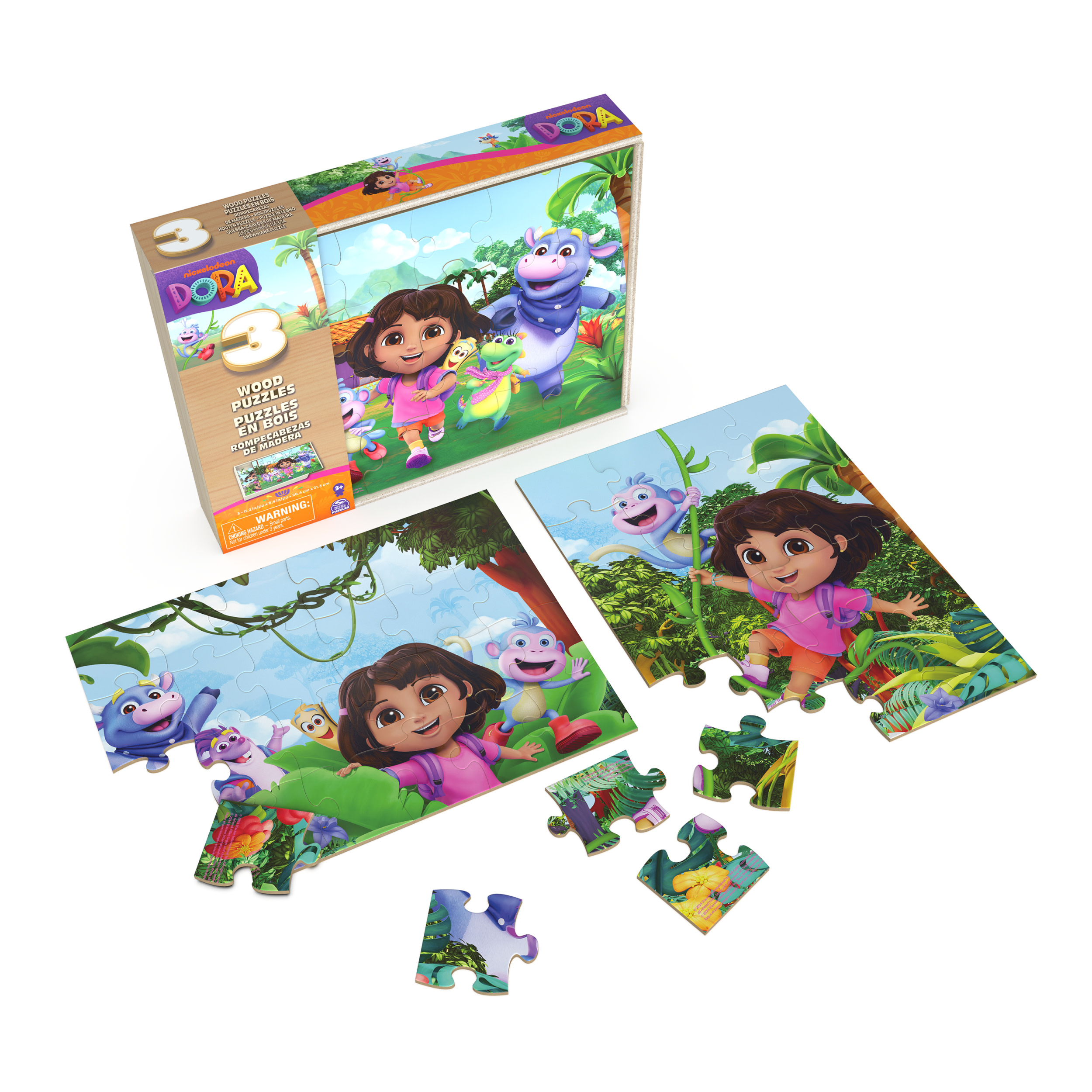 Scatola puzzle di Dora con Dora e i suoi amici. Pezzi di puzzle sparsi e due puzzle assemblati sono visibili.