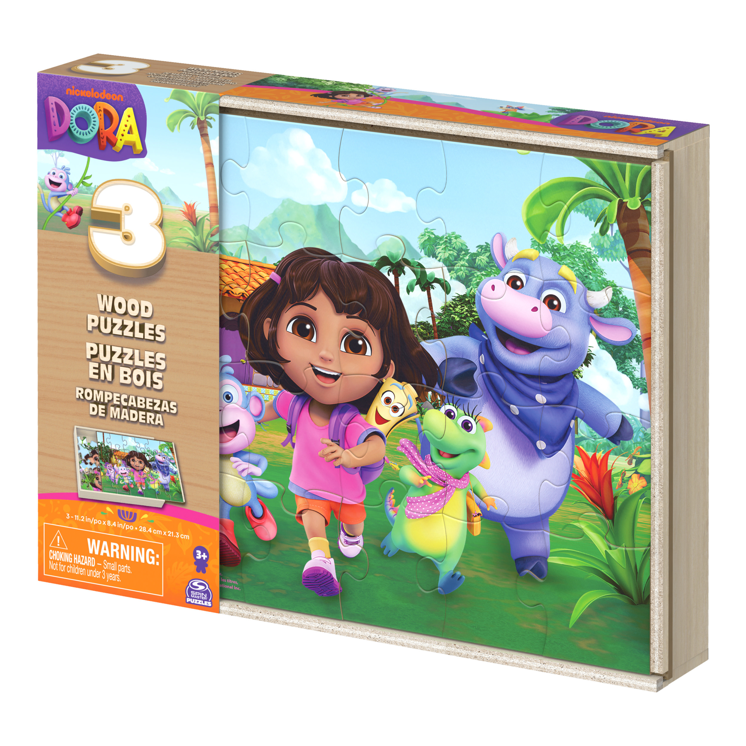 Scatola di puzzle con Dora e amici. Dora con maglietta rosa, Stivali, drago e mucca. La scena è all'aperto.