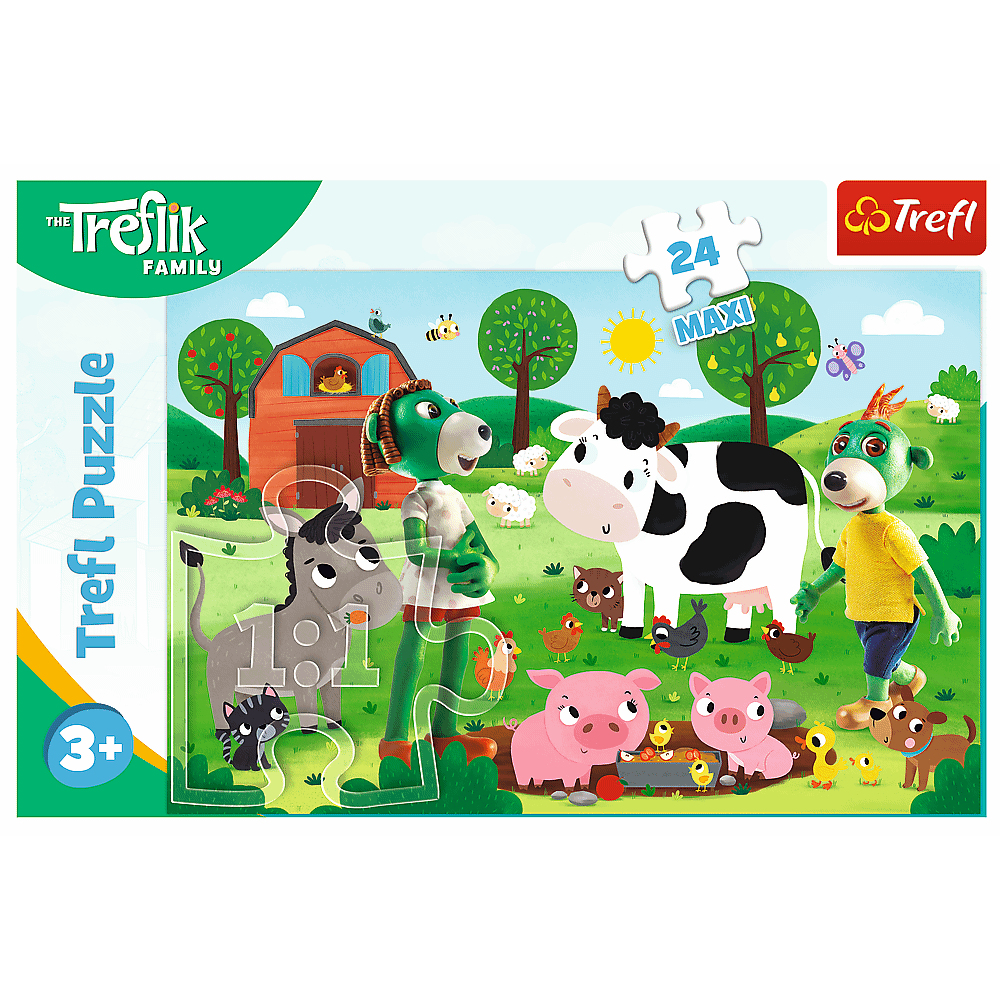 Een Trefl puzzeldoos. Cartoon boerderijdieren, waaronder een koe, varkens, kippen, een ezel en een hond, worden getoond op een groen landschap.