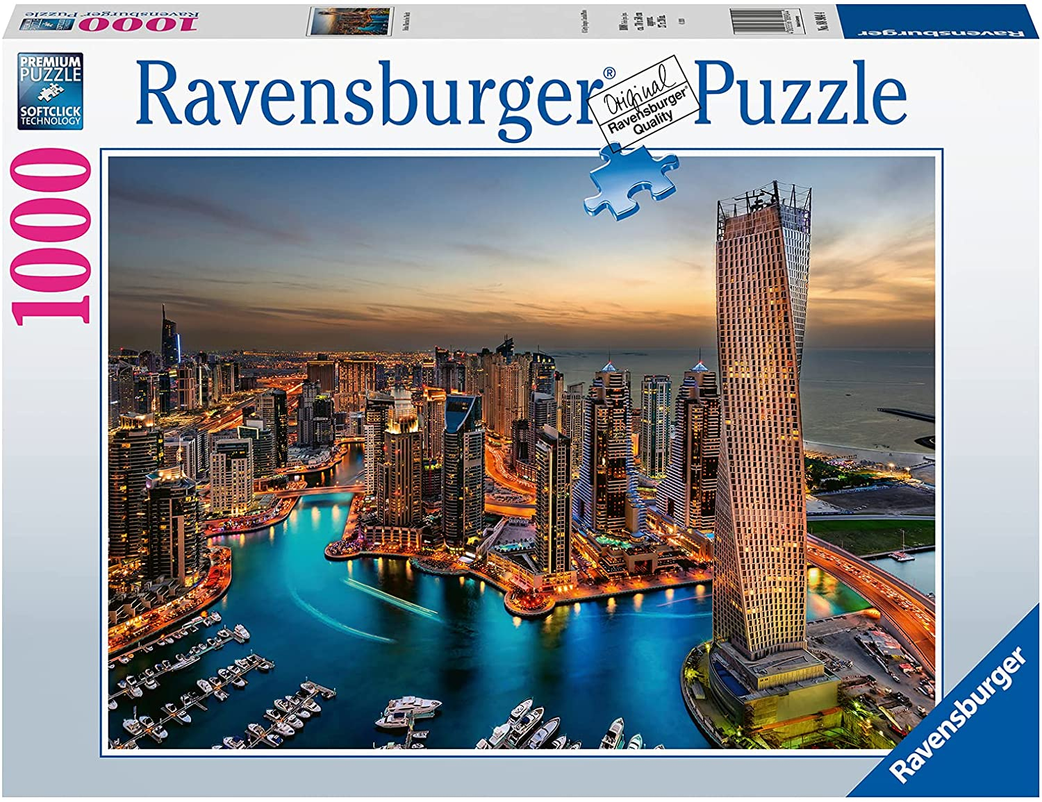 Puzzle Ravensburger da 1000 pezzi. Skyline della città al tramonto, con edifici alti, acqua, barche e un ponte.