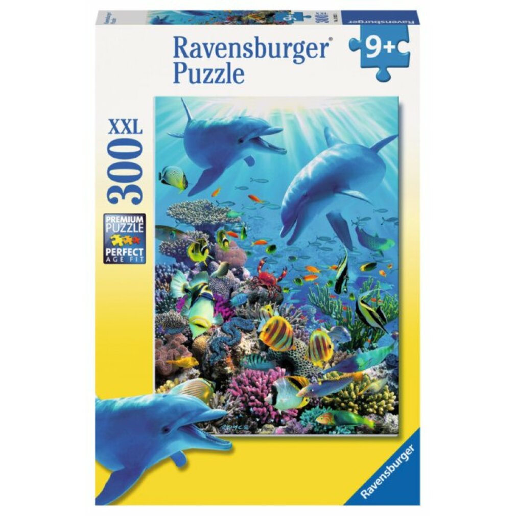 Scatola di puzzle con delfini, pesci e barriera corallina. La scatola è etichettata 'Ravensburger Puzzle 300 XXL'.