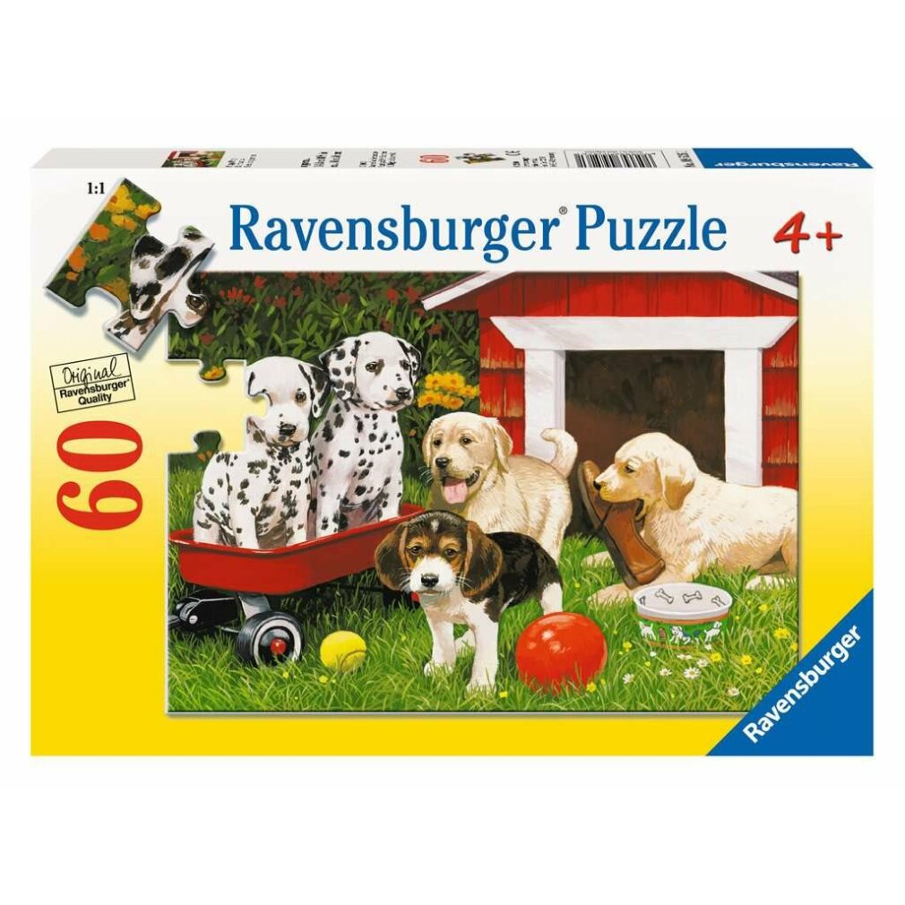 Scatola del puzzle con cuccioli. Contiene cuccioli di dalmata, beagle e golden retriever vicino a una casetta rossa e giocattoli.