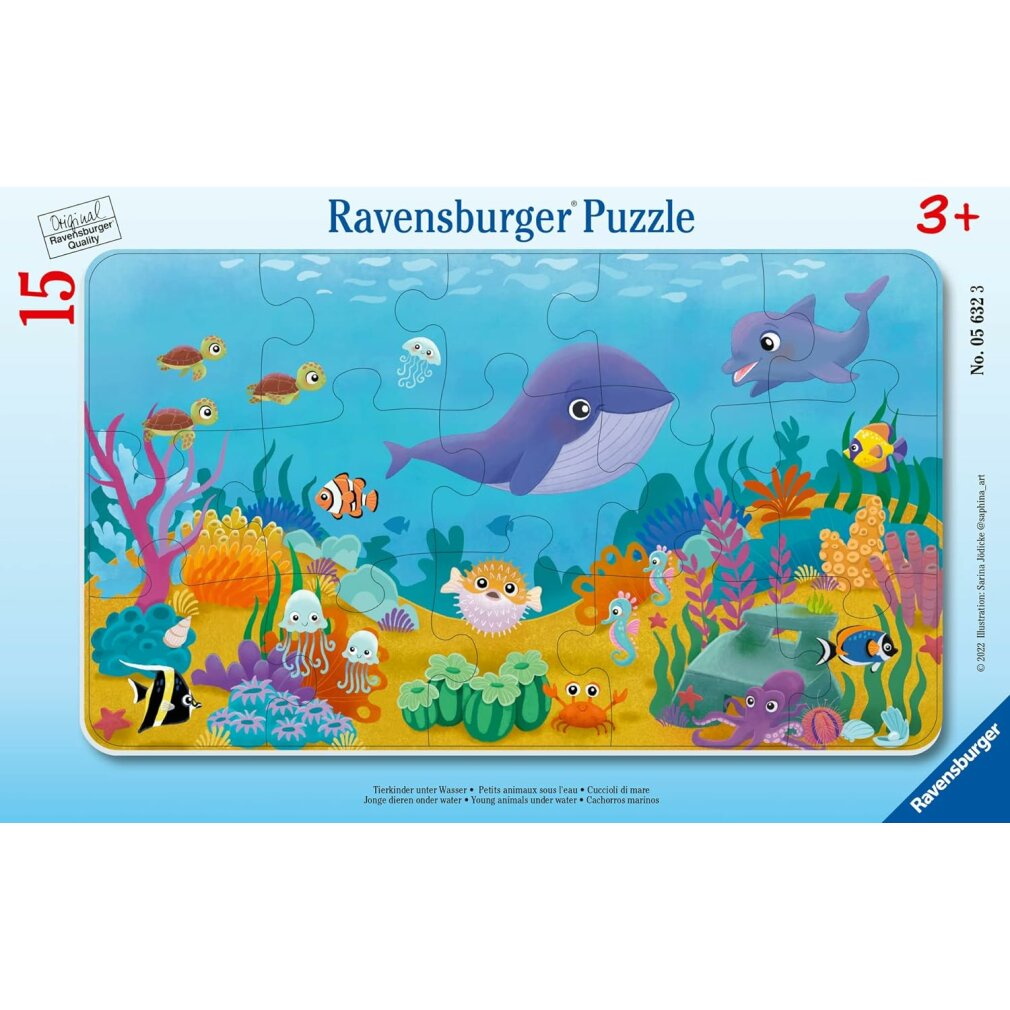 Un puzzle Ravensburger raffigura una scena sottomarina con una balena, un delfino, vari pesci, tartarughe, coralli e altre creature marine.