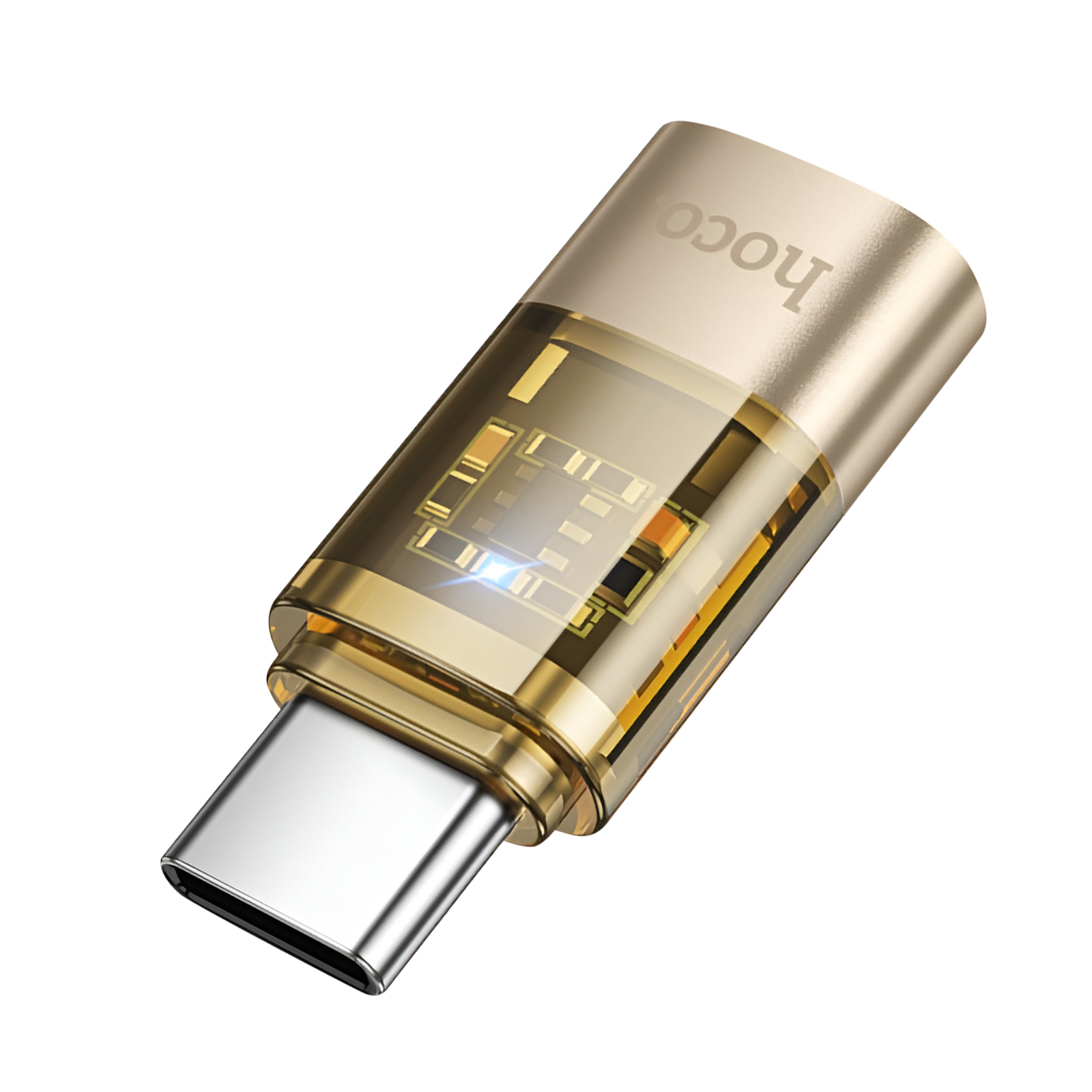 Adattatore USB-C dorato e trasparente. L'adattatore ha un connettore metallico argentato e circuiti interni visibili.