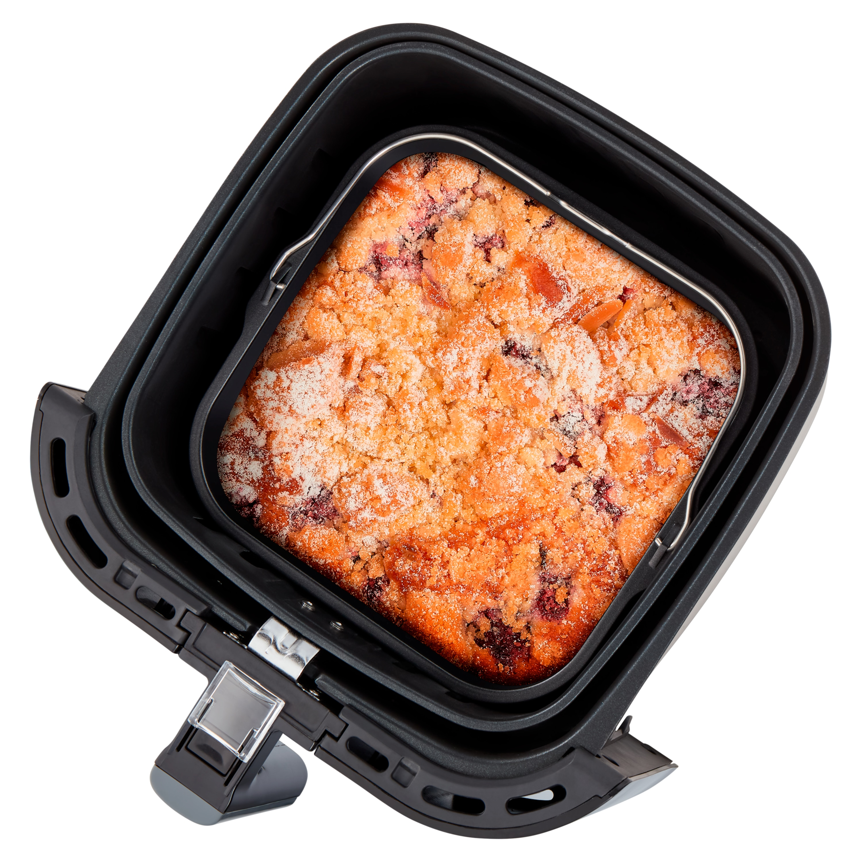 Frytownica powietrzna z pieczonym deserem w środku. Deser ma złotą skórkę.