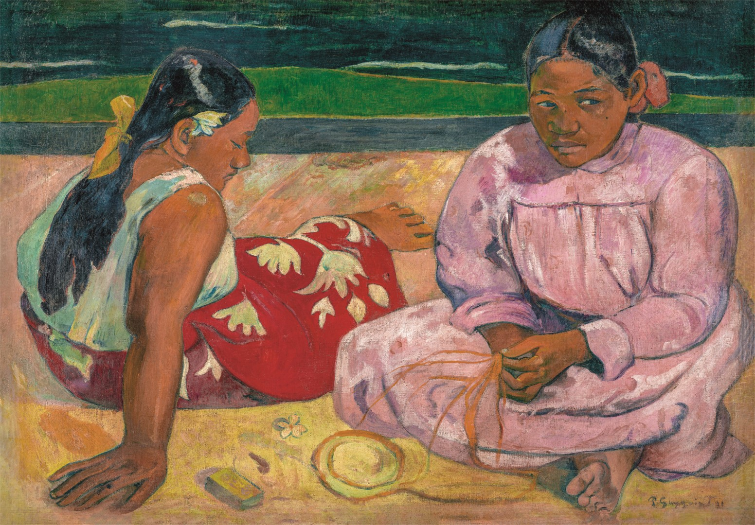 Two women sit on sand. One in a red dress with white floral design, the other in pink. Background shows green and dark blue.