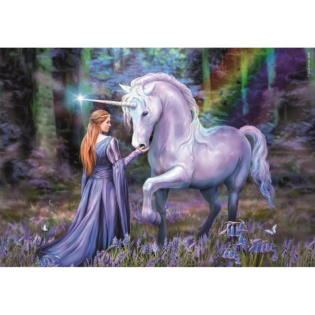 A woman in a blue dress touches a white unicorn's nose in a forest. Flowers and butterflies surround them. Rainbow in the background.