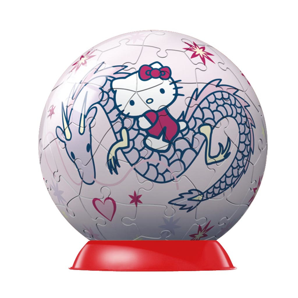 Ein Hello Kitty Puzzleball auf roter Basis. Es zeigt Hello Kitty auf einem Drachen mit rosa und lila Details und Sternmustern.