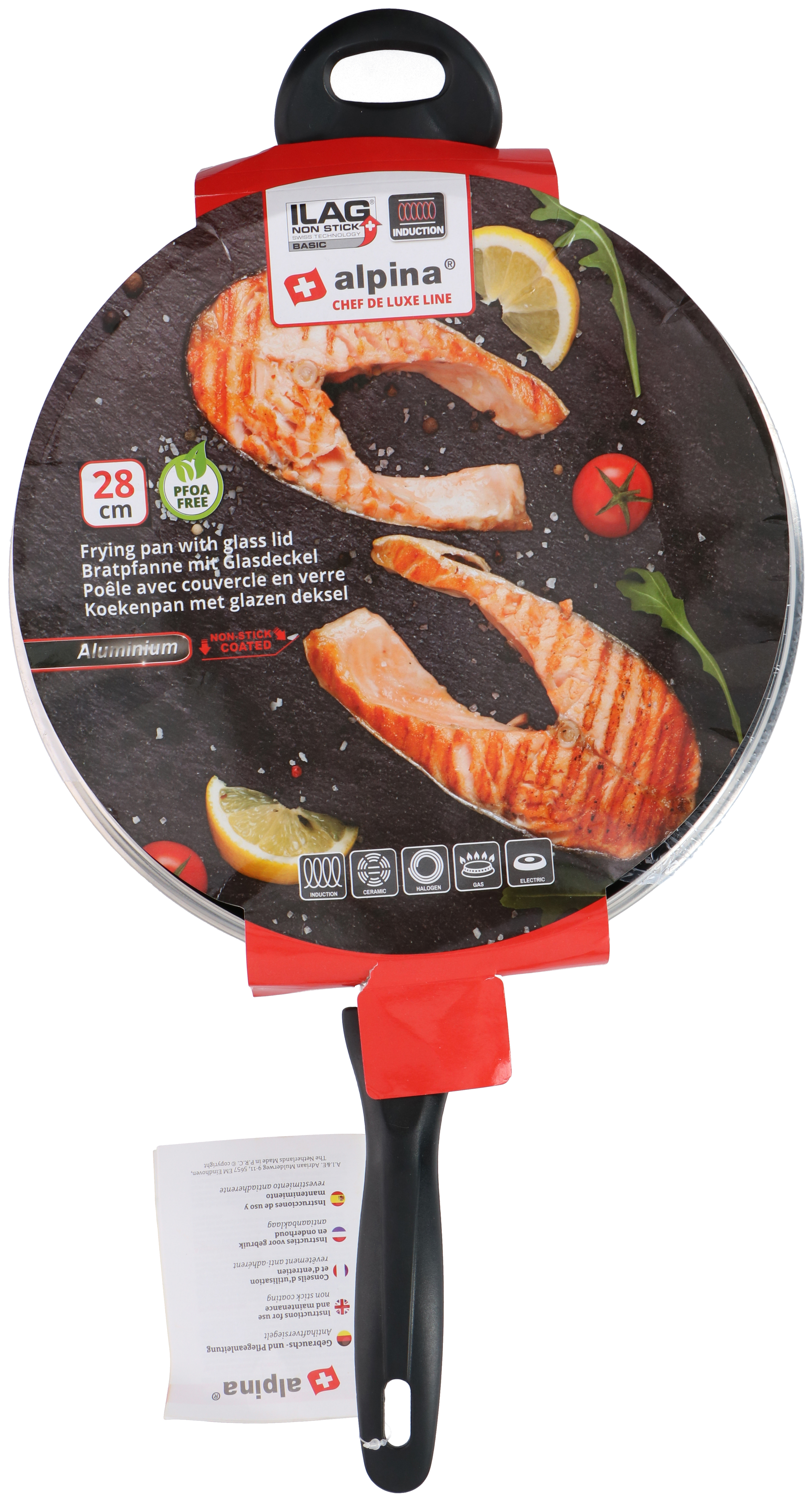 A frying pan with salmon, lemon, and tomato. It is non-stick, induction-ready, and has a glass lid.