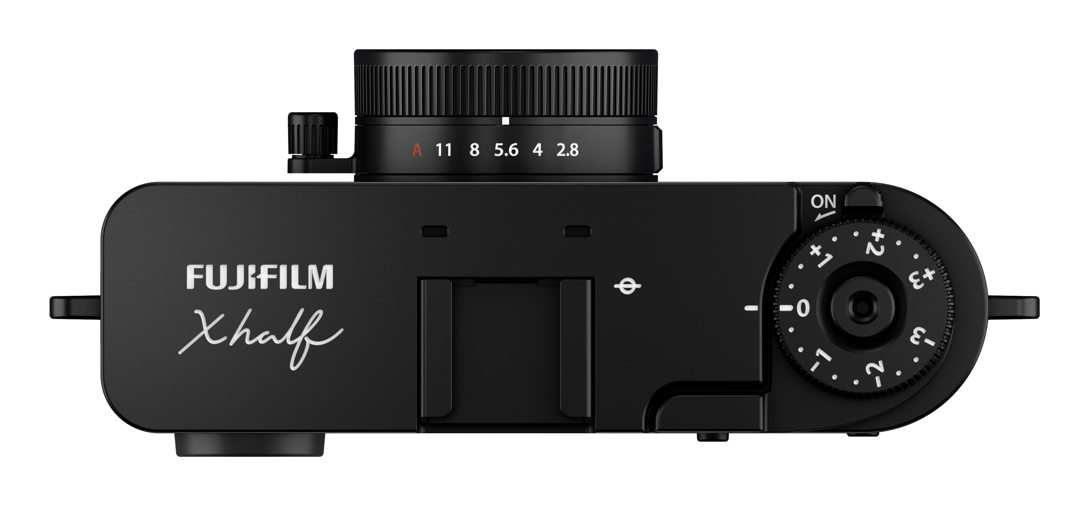 Widok z góry czarnego aparatu Fujifilm X half, z pokrętłami, ustawieniami obiektywu i widocznym przełącznikiem 'ON'.