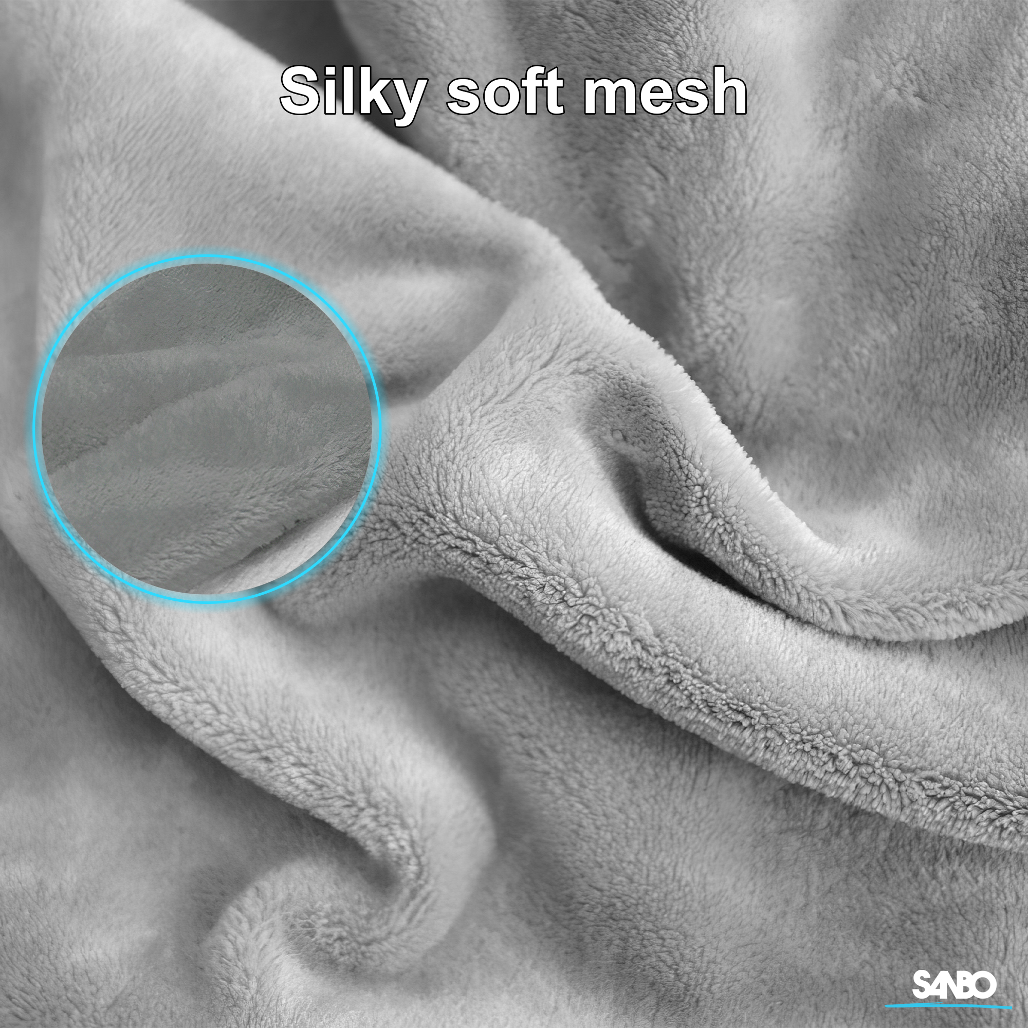 Close-up of a soft, gray blanket labeled 'Silky soft mesh'. A magnified section is highlighted.