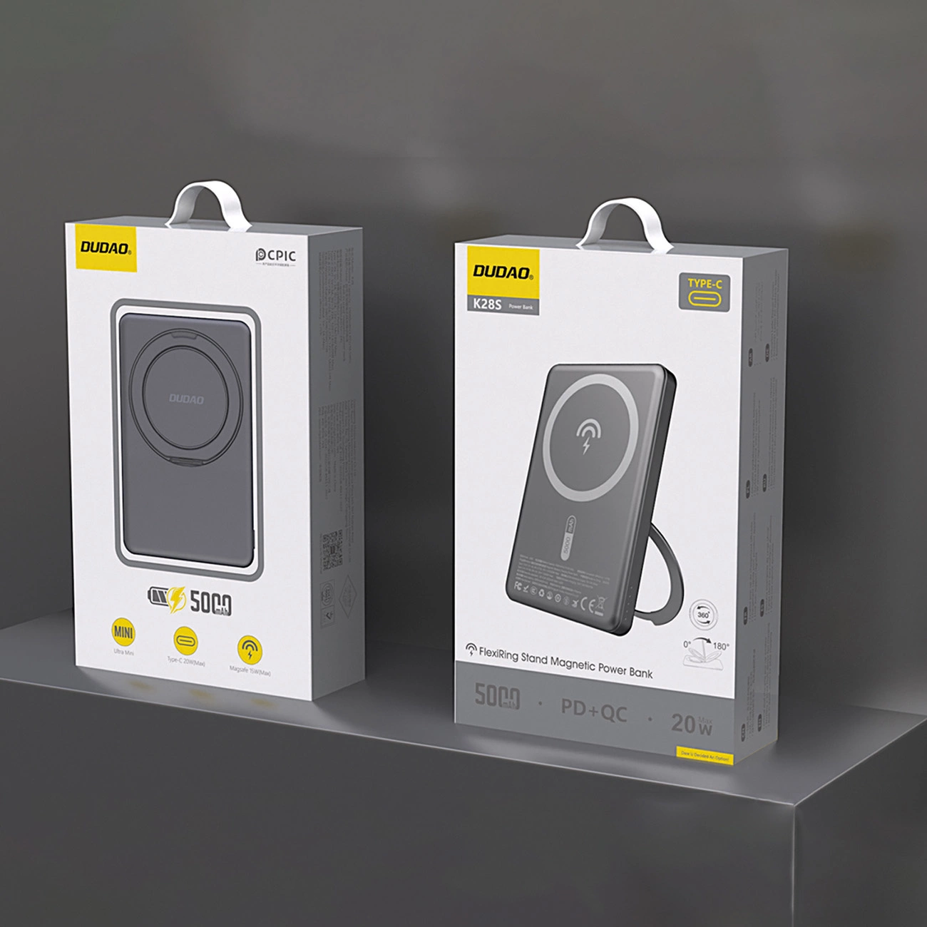Dwa szare pudełka power banków DUDOA. Jeden pokazuje mini power bank, drugi magnetyczny power bank z podstawką FlexiRing.