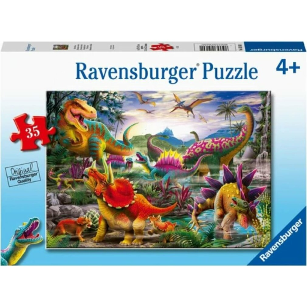 Scatola di puzzle con illustrazione di dinosauri. Dinosauri di vari colori in una scena preistorica, con il logo Ravensburger.
