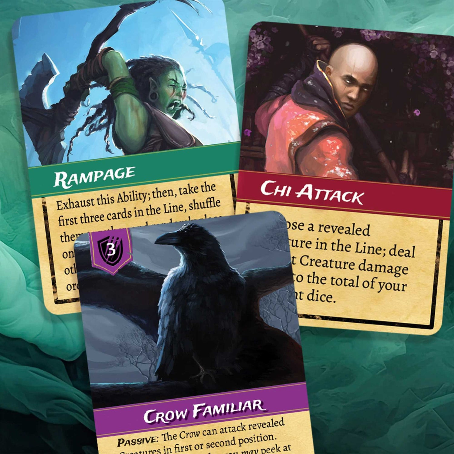 Drei Fantasy-Karten: Rampage, Chi Attack und Crow Familiar. Jede Karte zeigt Illustrationen und Spieltext auf tealfarbenem Hintergrund.