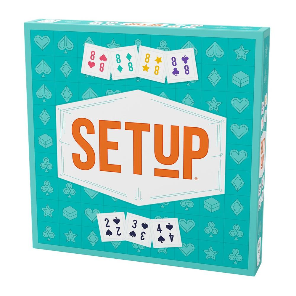 Una caja del juego 'SETUP'. Se muestran cartas con diferentes palos y números. La caja es de color verde azulado con texto blanco y naranja.