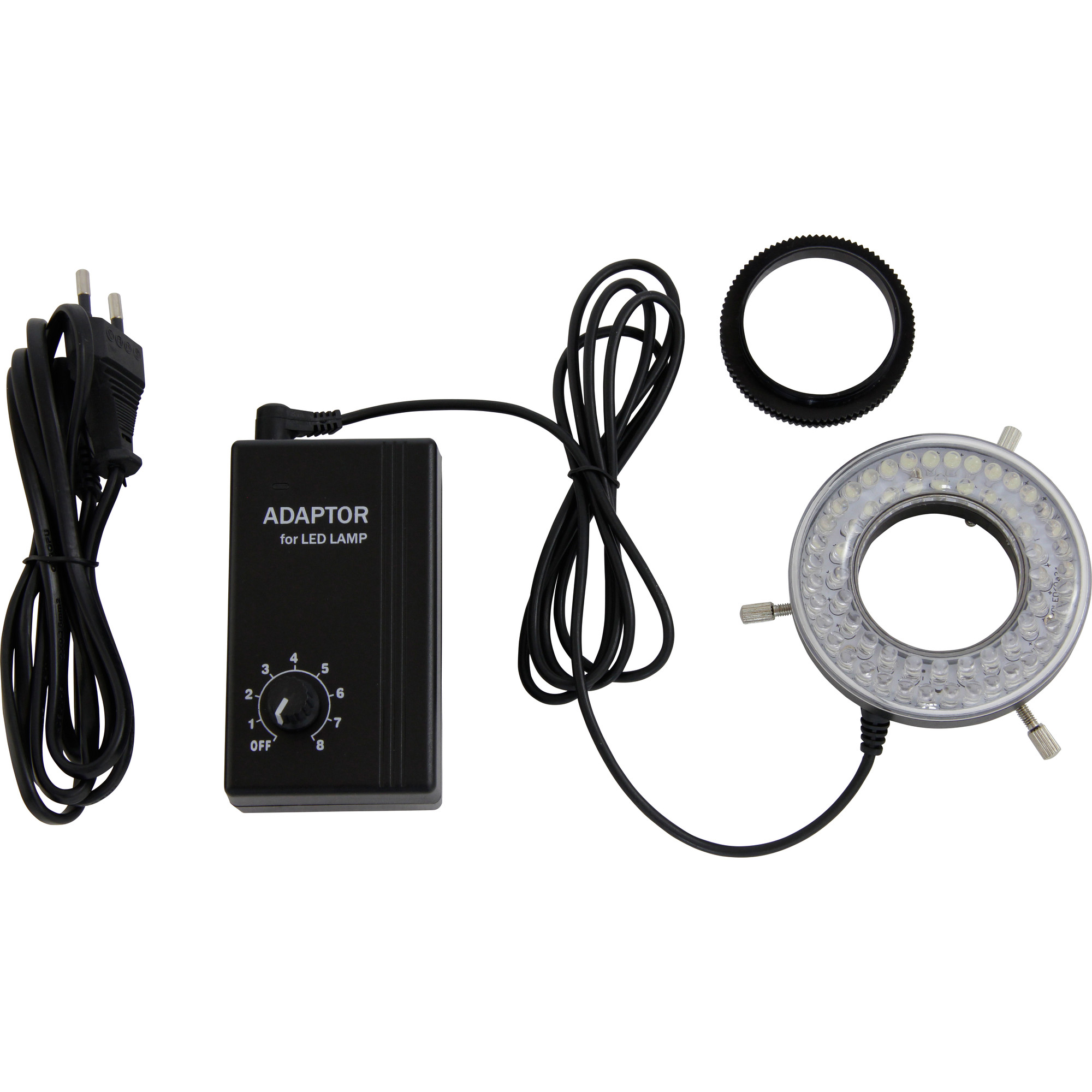 Ein Ringlicht-Kit mit Netzteil, Steuereinheit und schwarzem Kabel. Schwarzes ringförmiges Objekt.