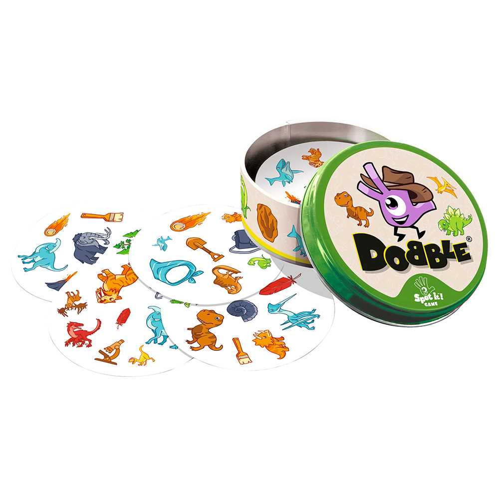 Ein 'Dobble'-Spielset. Geöffnete Dose mit Karten mit Dinosauriern und anderen thematischen Objekten. Grüne Dose mit lila Figur auf dem Deckel.