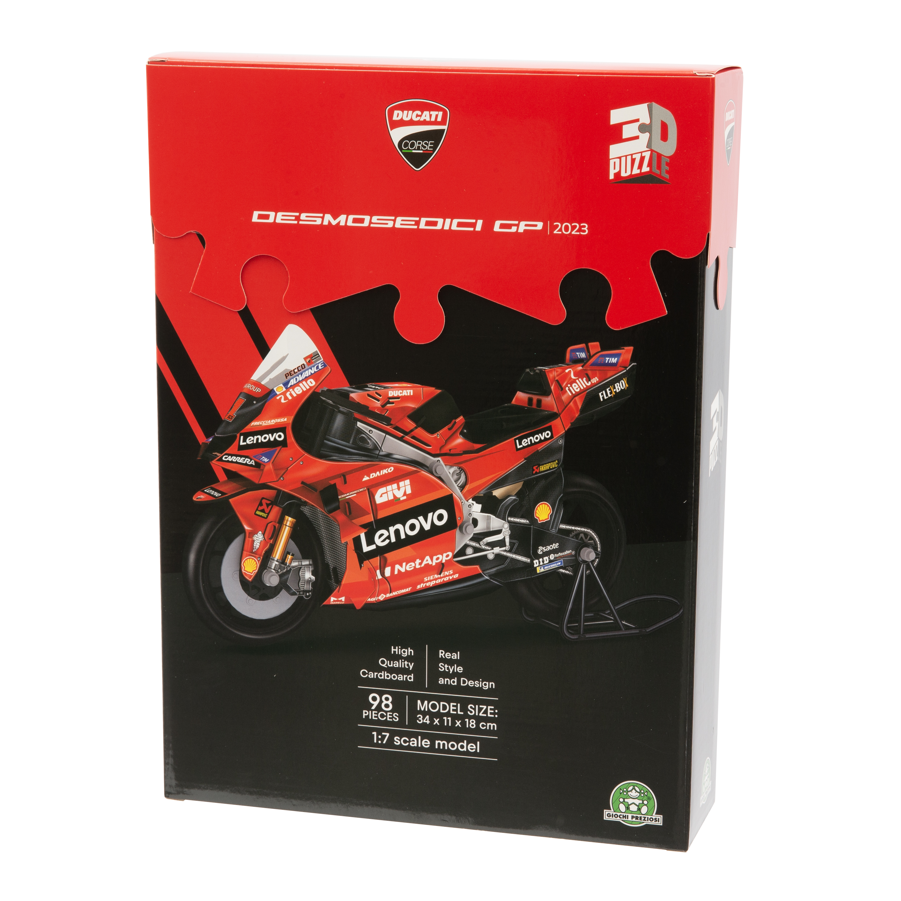 Grafika pudełka do układanki motocykla Ducati. Czerwone i czarne pudełko z elementami układanki. Obraz motocykla na pudełku.