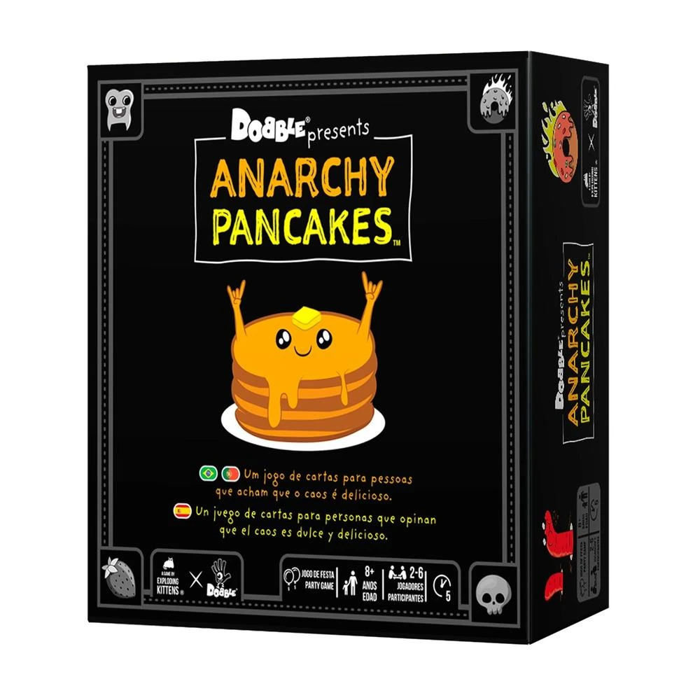 Una caja del juego Anarchy Pancakes presenta una pila de panqueques con una cara sonriente. El texto incluye detalles del juego y logotipos.
