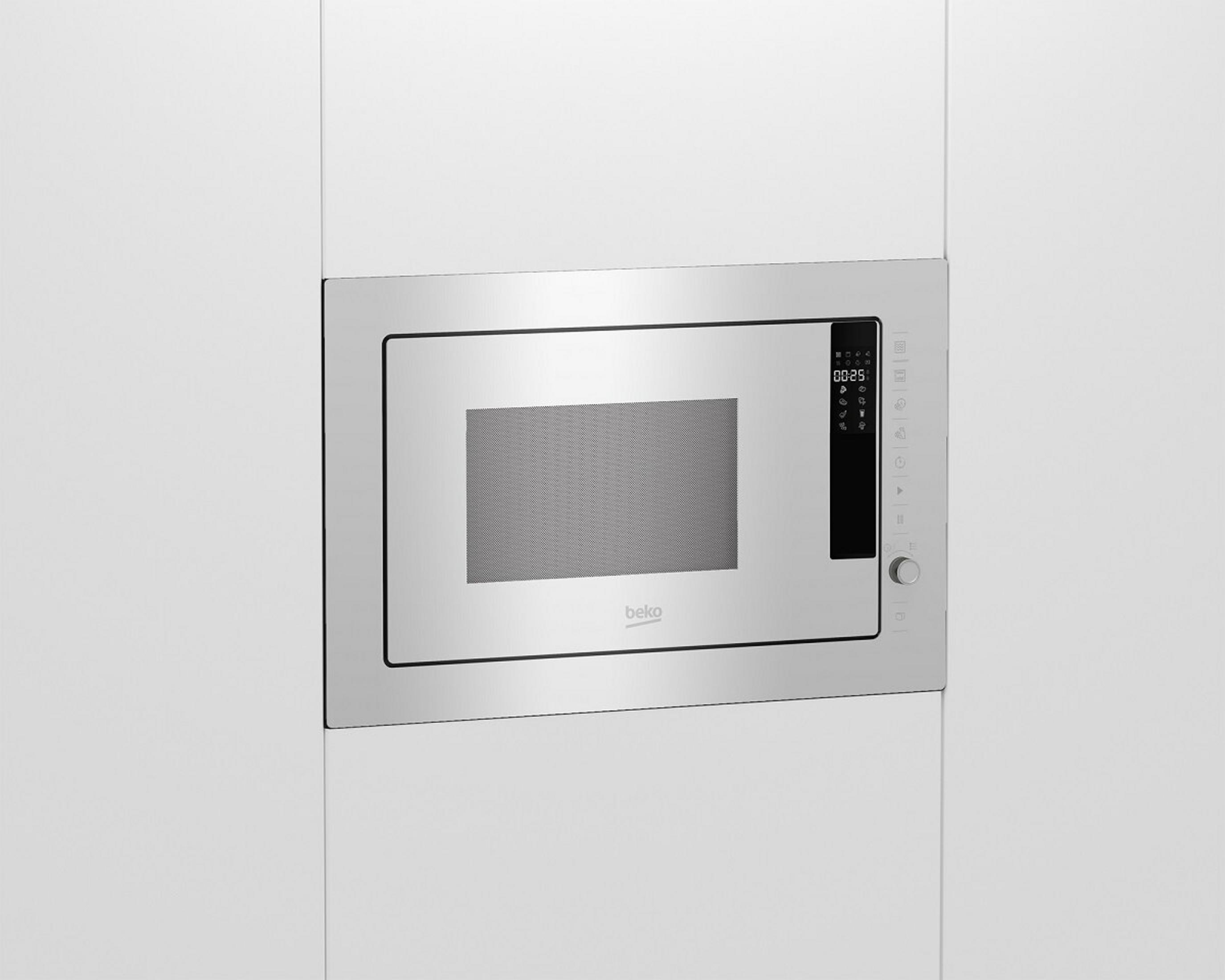 A built-in silver microwave oven. It has a digital display and a control panel with various buttons and a knob.