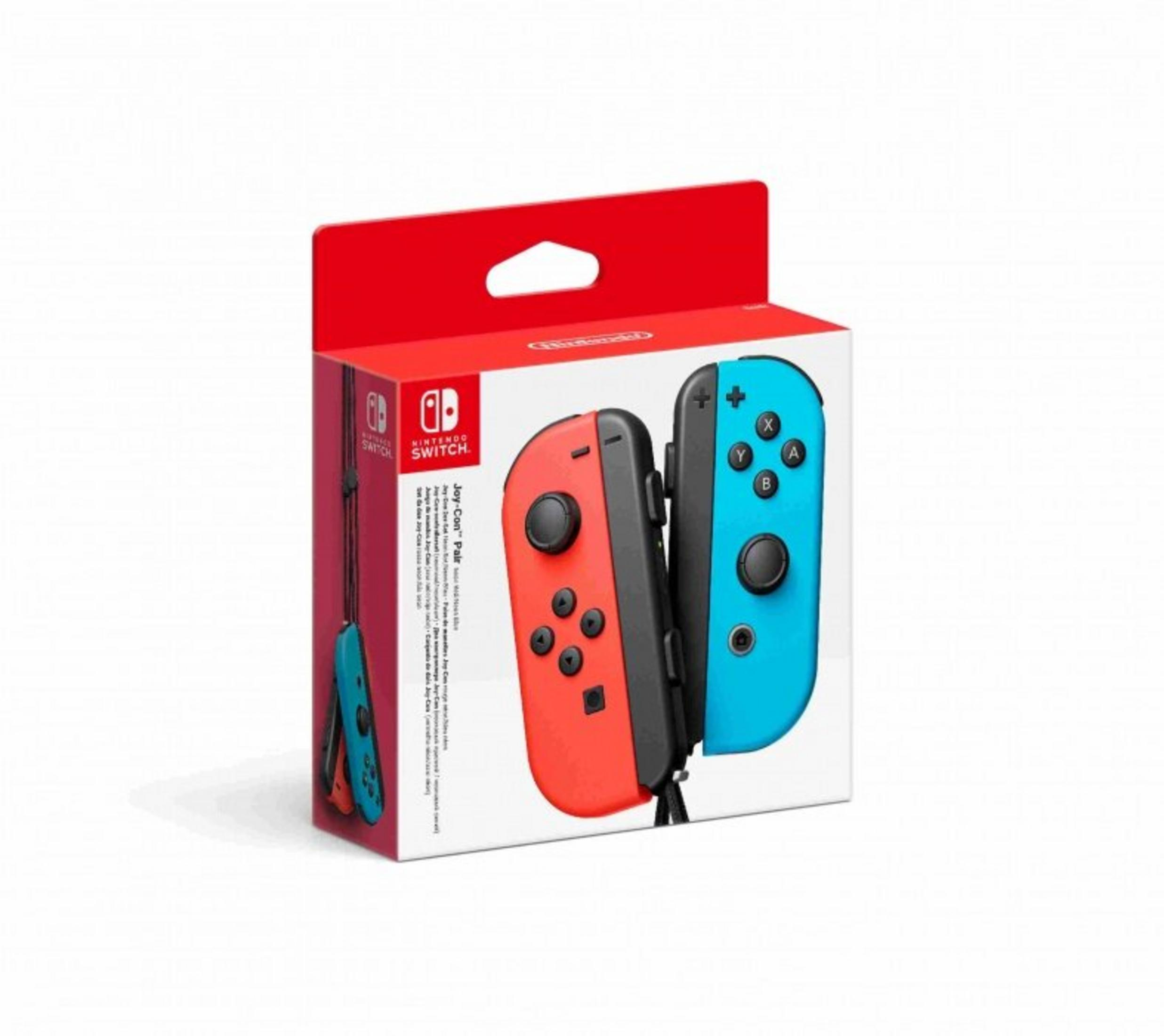 Mandos Joy-Con de Nintendo Switch en caja. Uno rojo, uno azul. Caja blanca con tapa roja. Texto en el lateral.